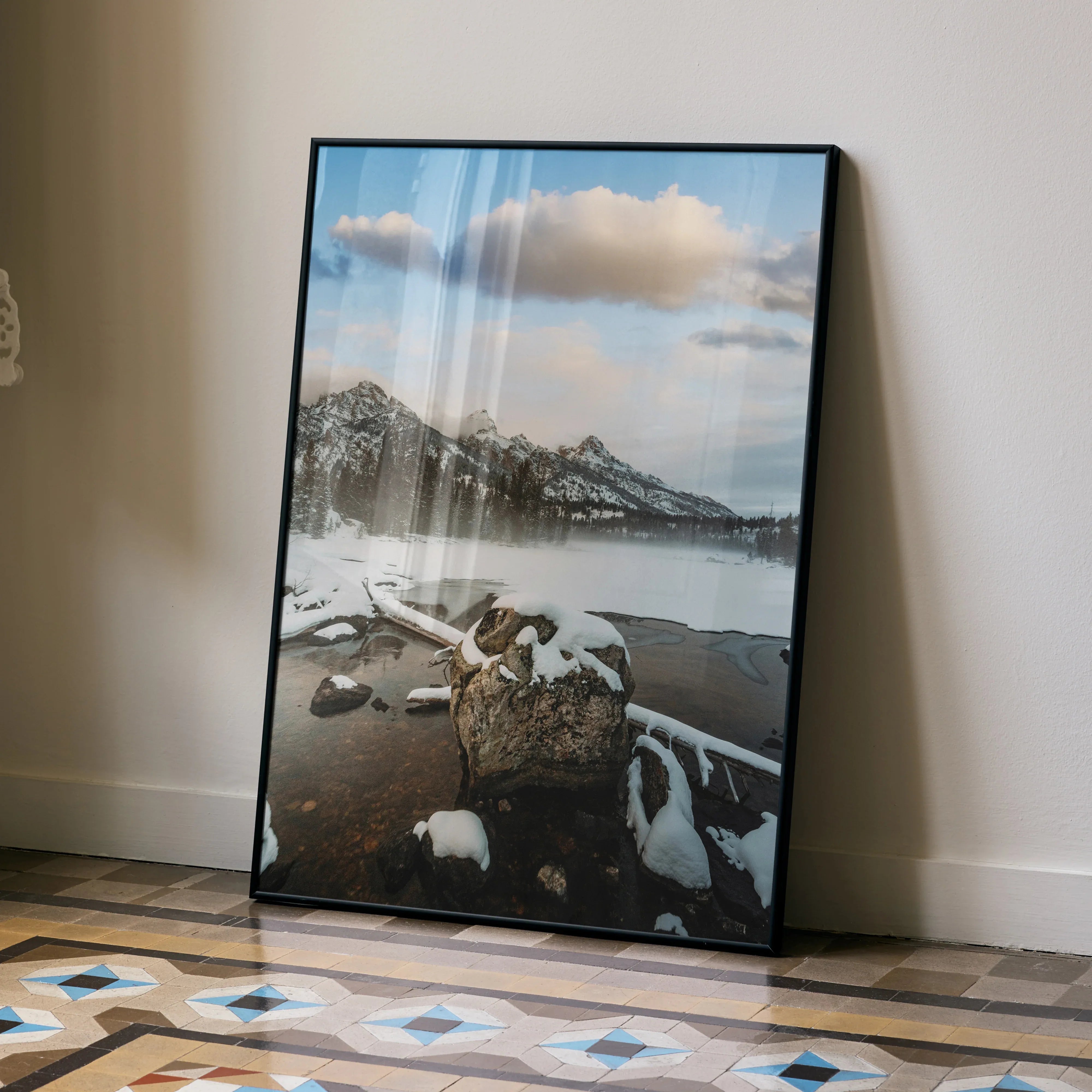 Vertical poster of snowy mountain range with lake and cloudy sky, nature wall art.