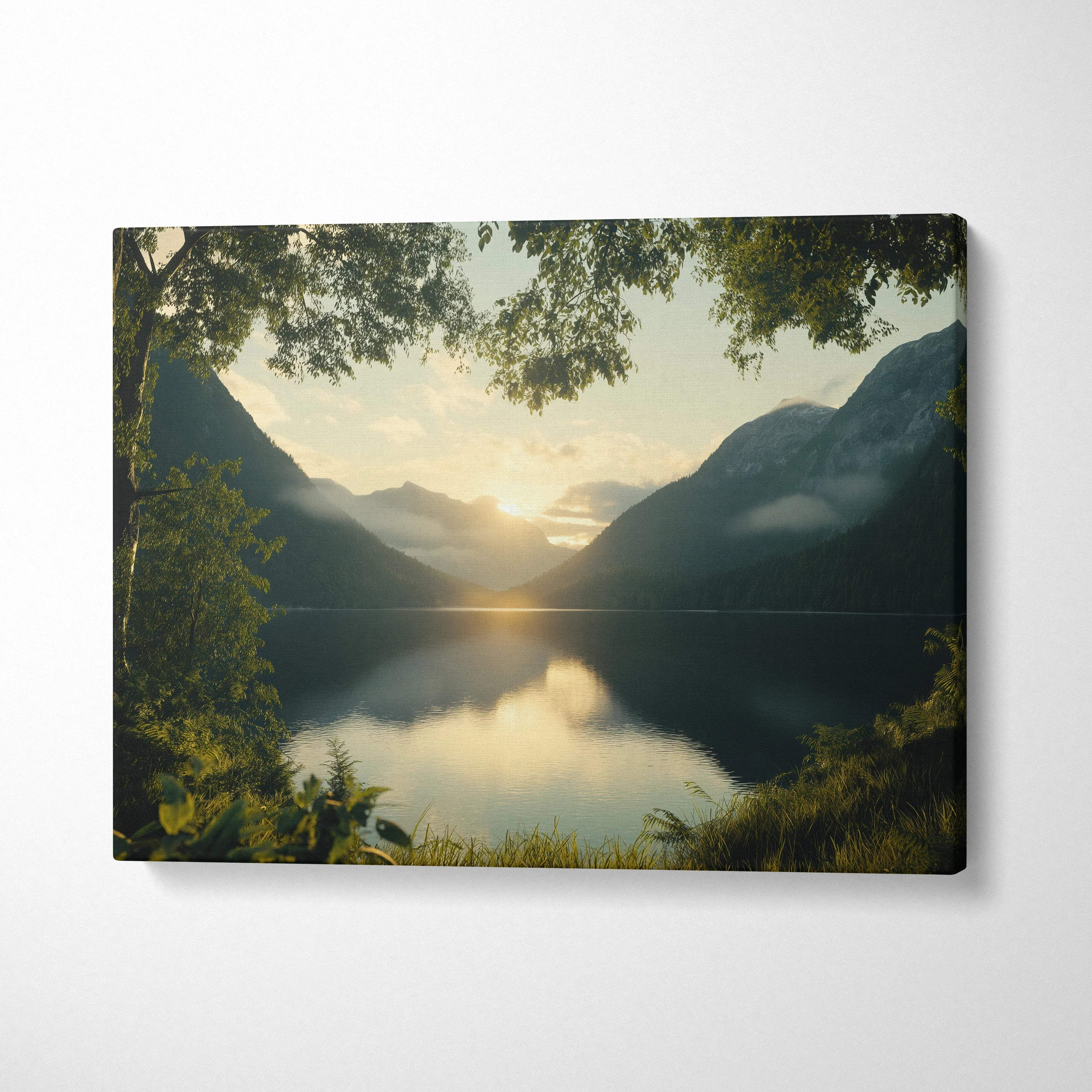 Serene canvas print of golden sunrise over tranquil lake amid misty mountains