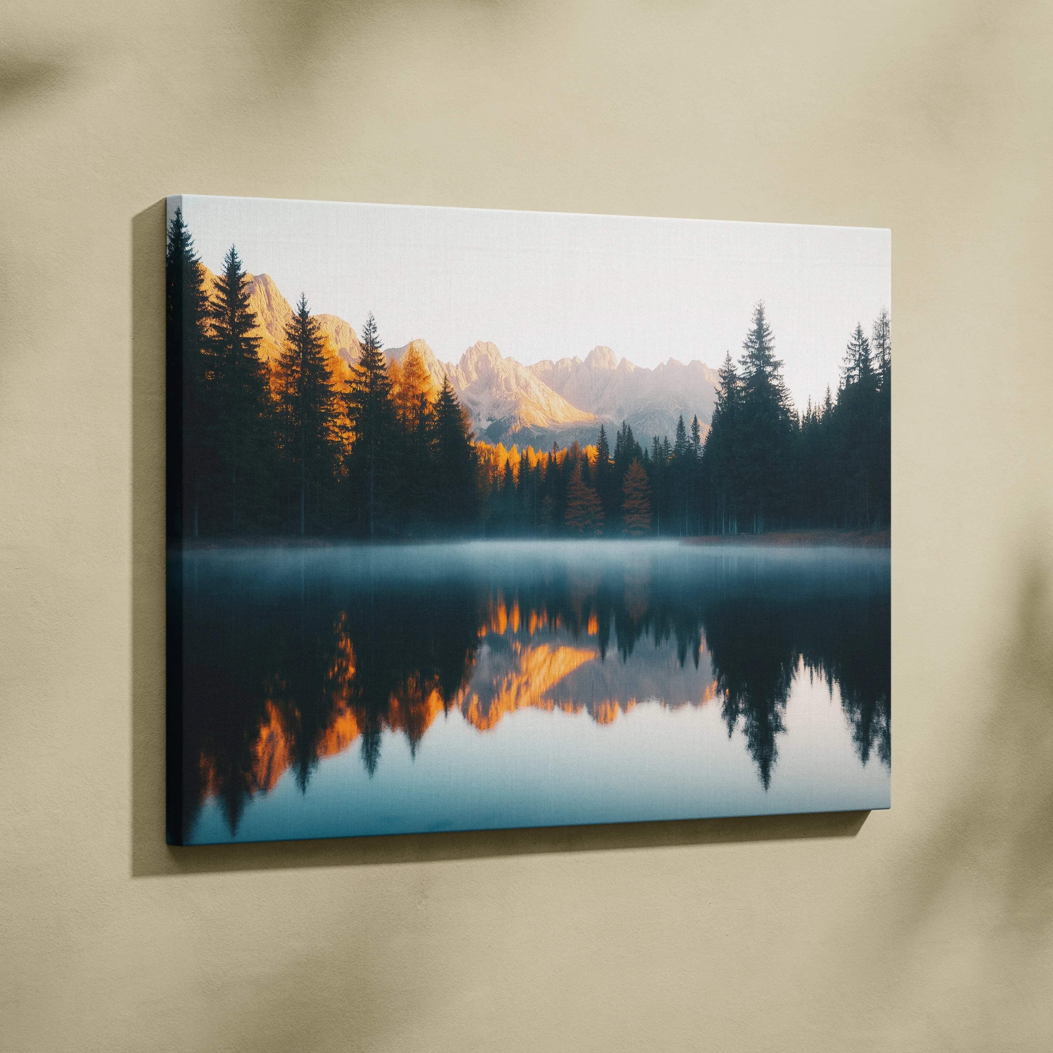 Canvas print of serene mountain lake with forest reflections at golden hour