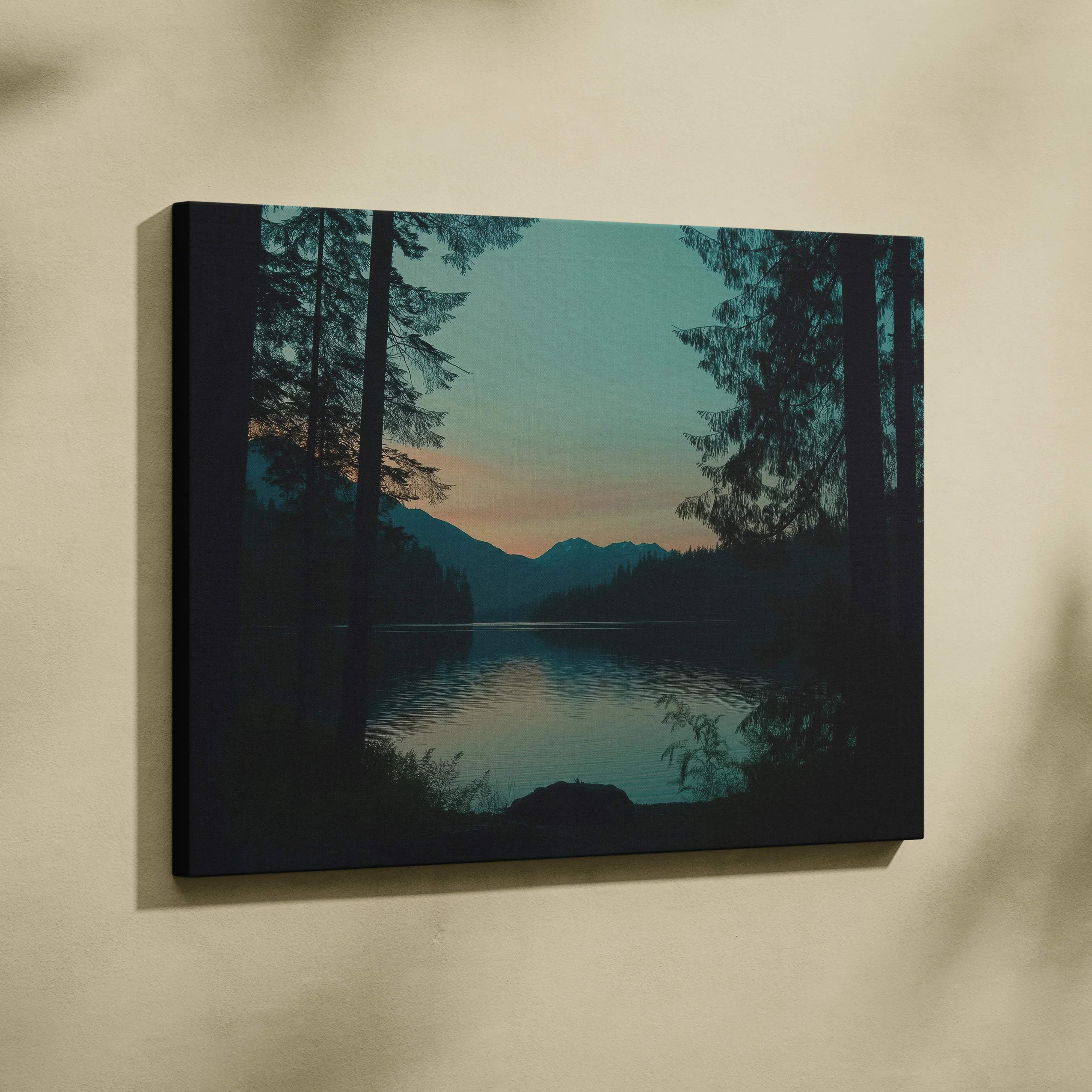 Canvas print of serene forest lake at dusk with mountains and sunset sky