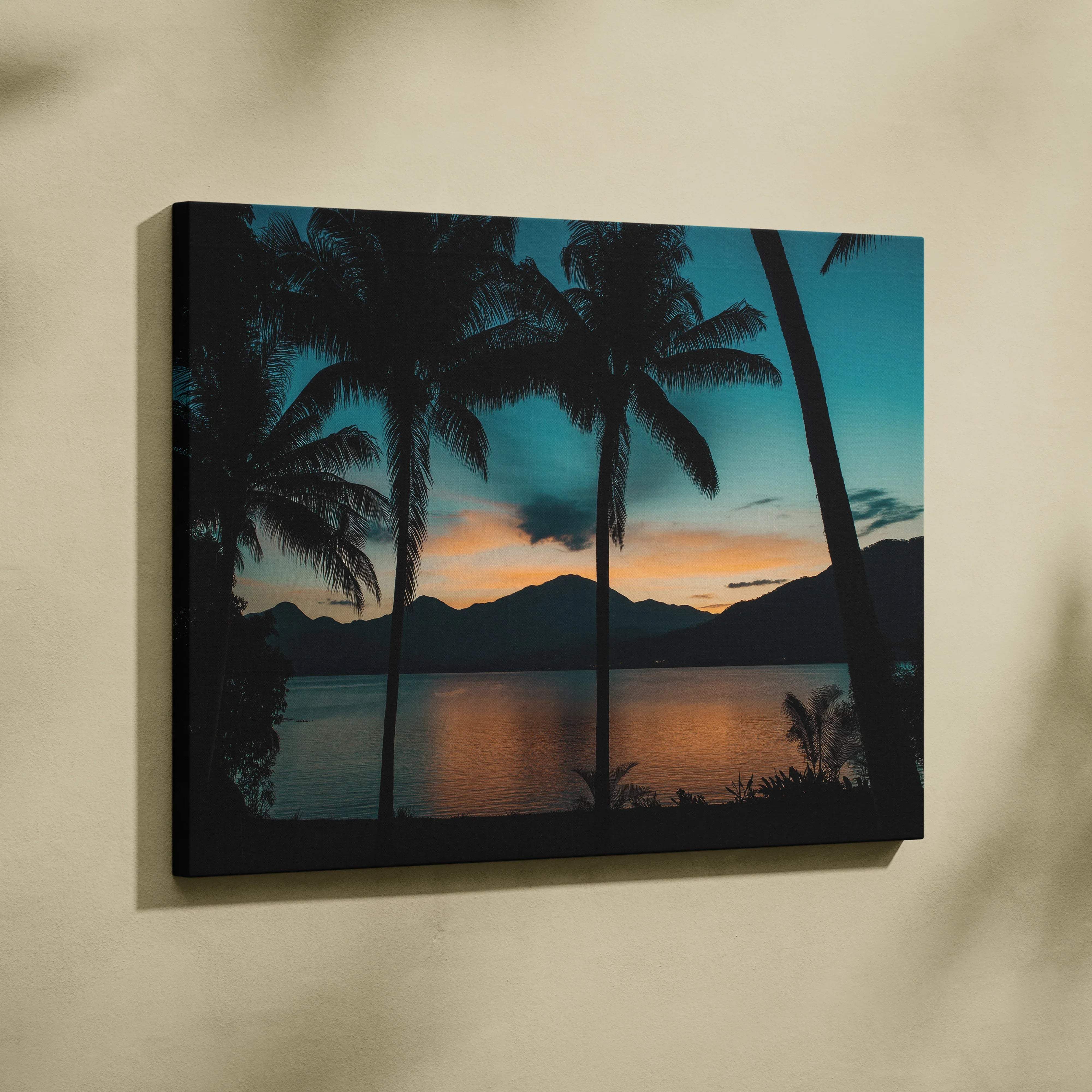 Canvas print of palm trees silhouetted against teal orange sunset on wall