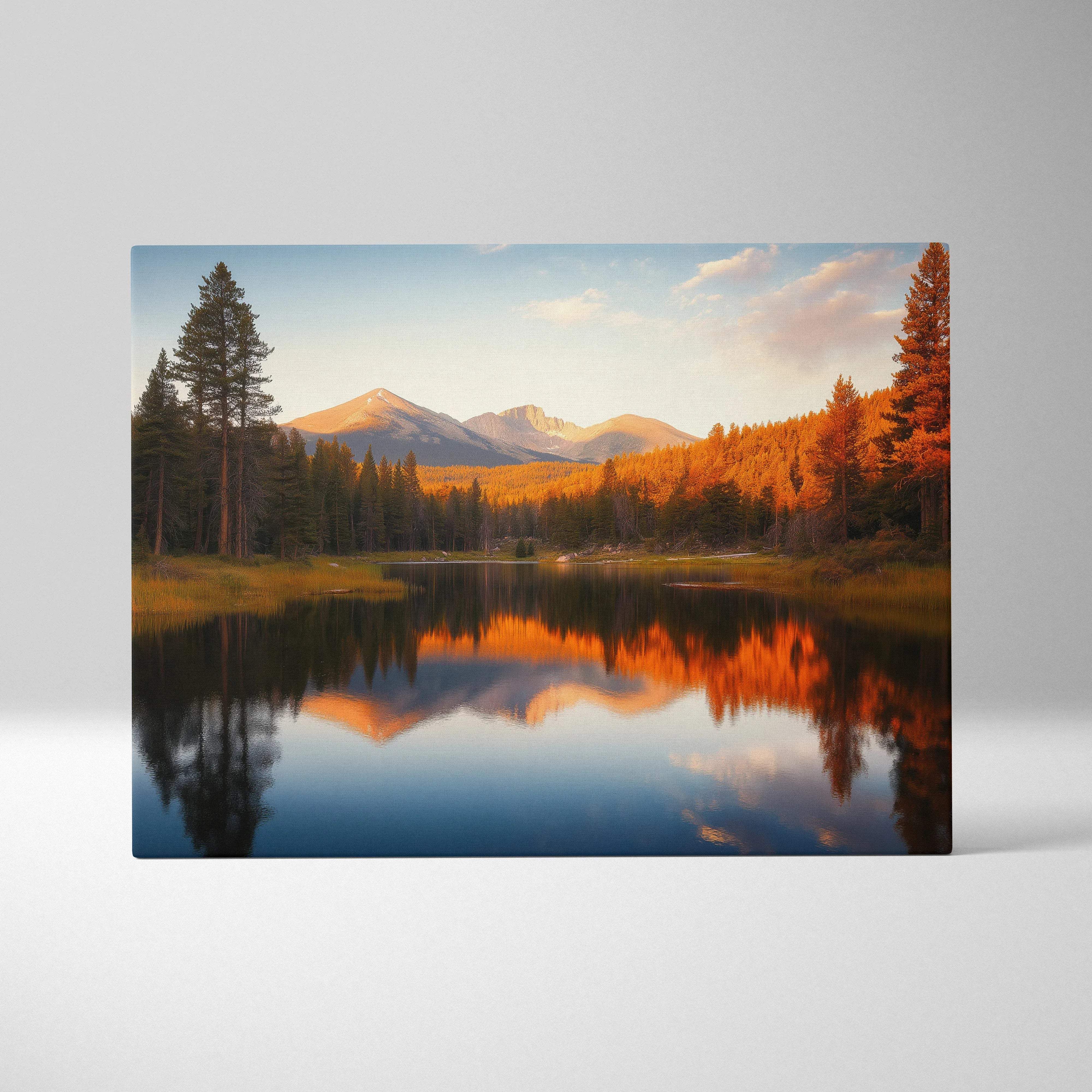 Canvas print of serene mountain lake with golden autumn trees and snow peaks