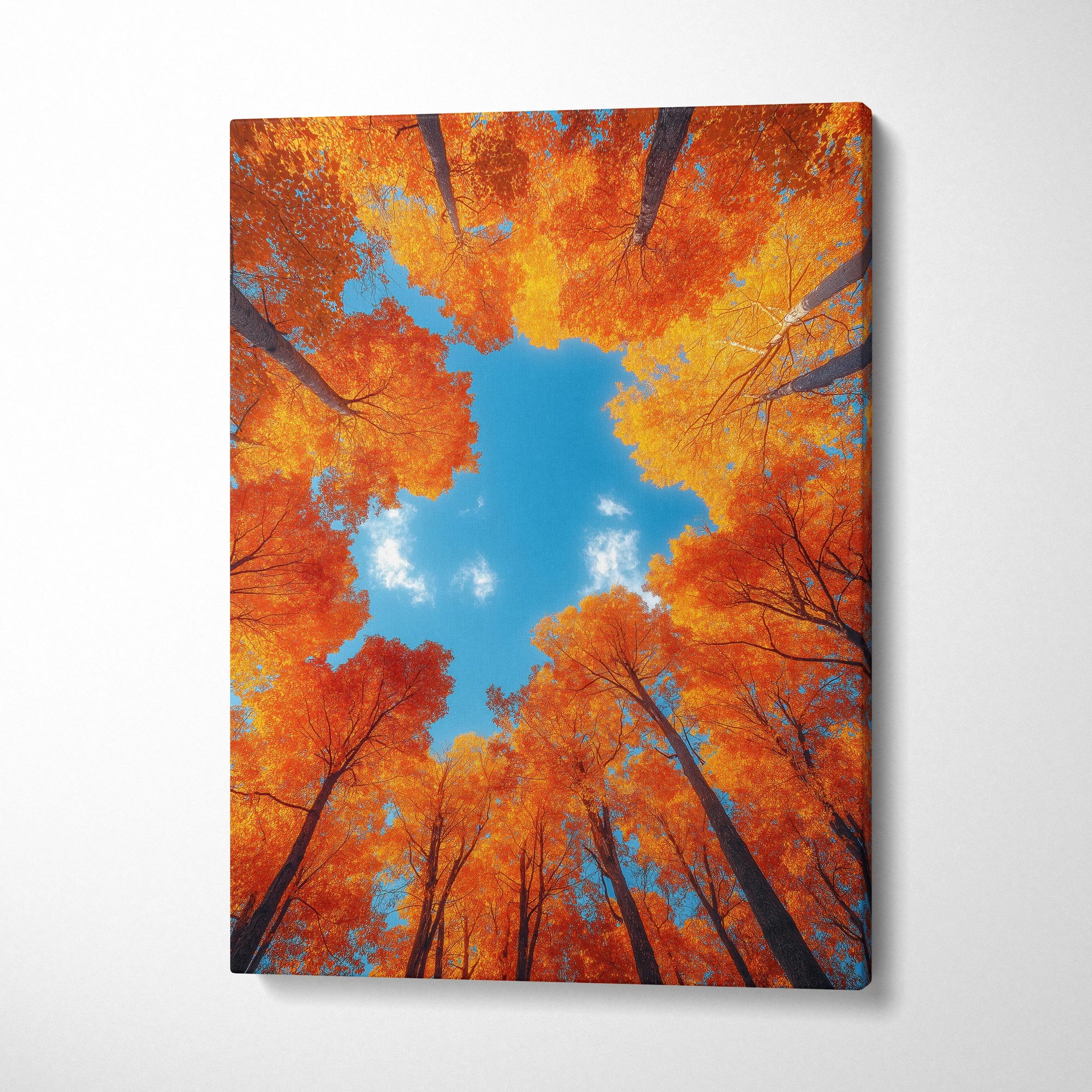 Vertical canvas wall art featuring vibrant autumn forest trees with bright orange leaves against a clear blue sky.