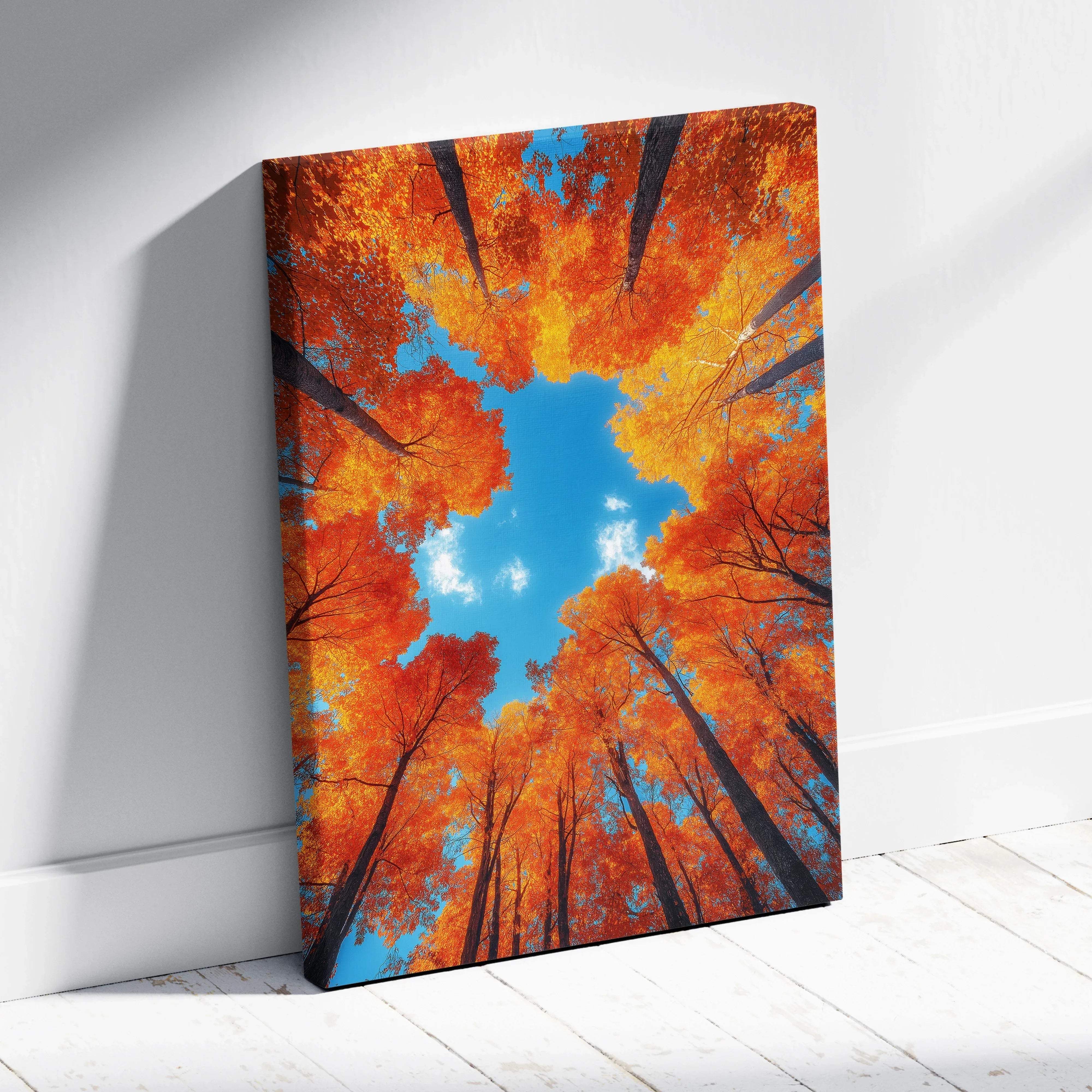Autumn forest canopy treetop view canvas wall art featuring vibrant orange and yellow leaves against a clear blue sky