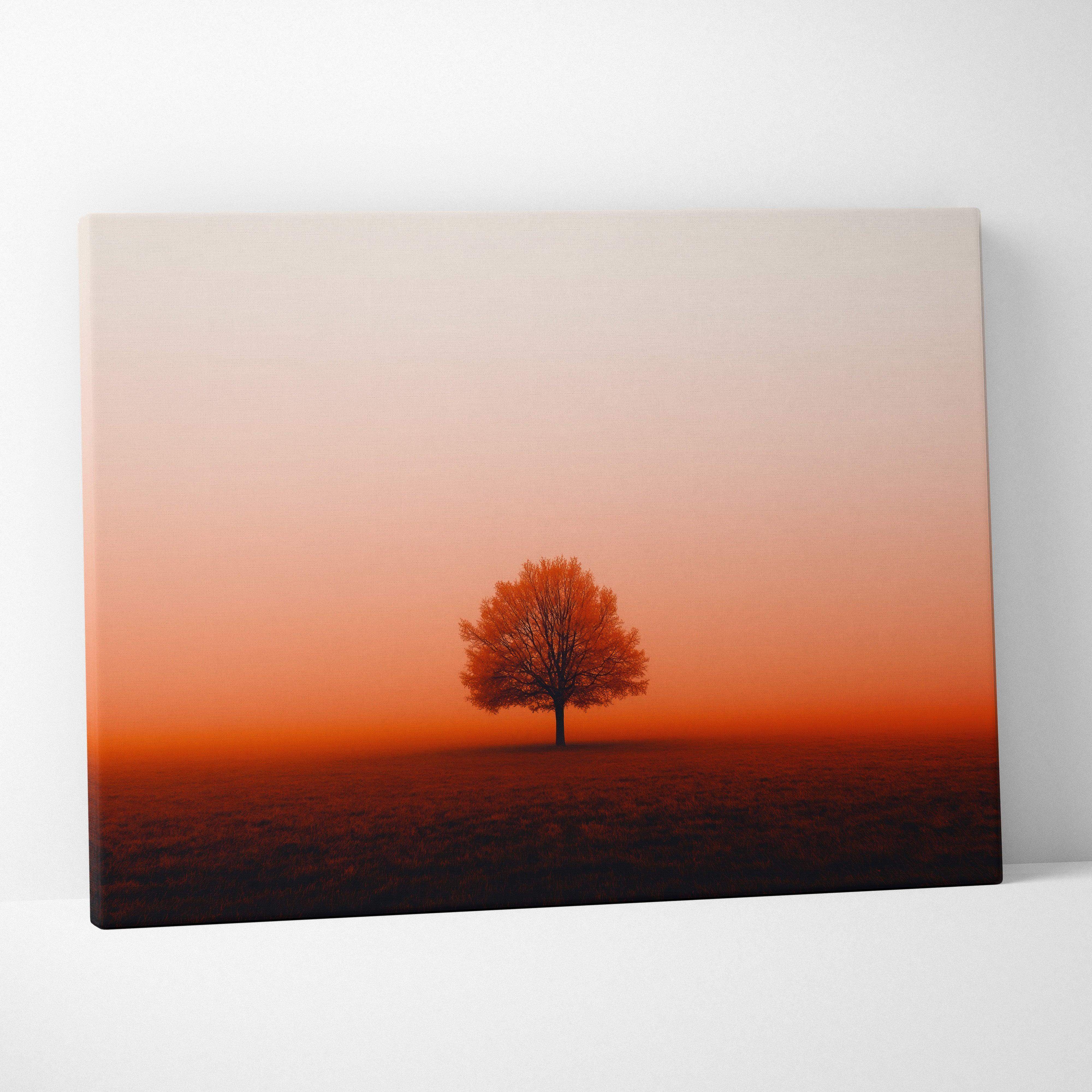 A canvas print of a minimalist autumn landscape with a solitary tree silhouetted against a warm gradient sunset sky