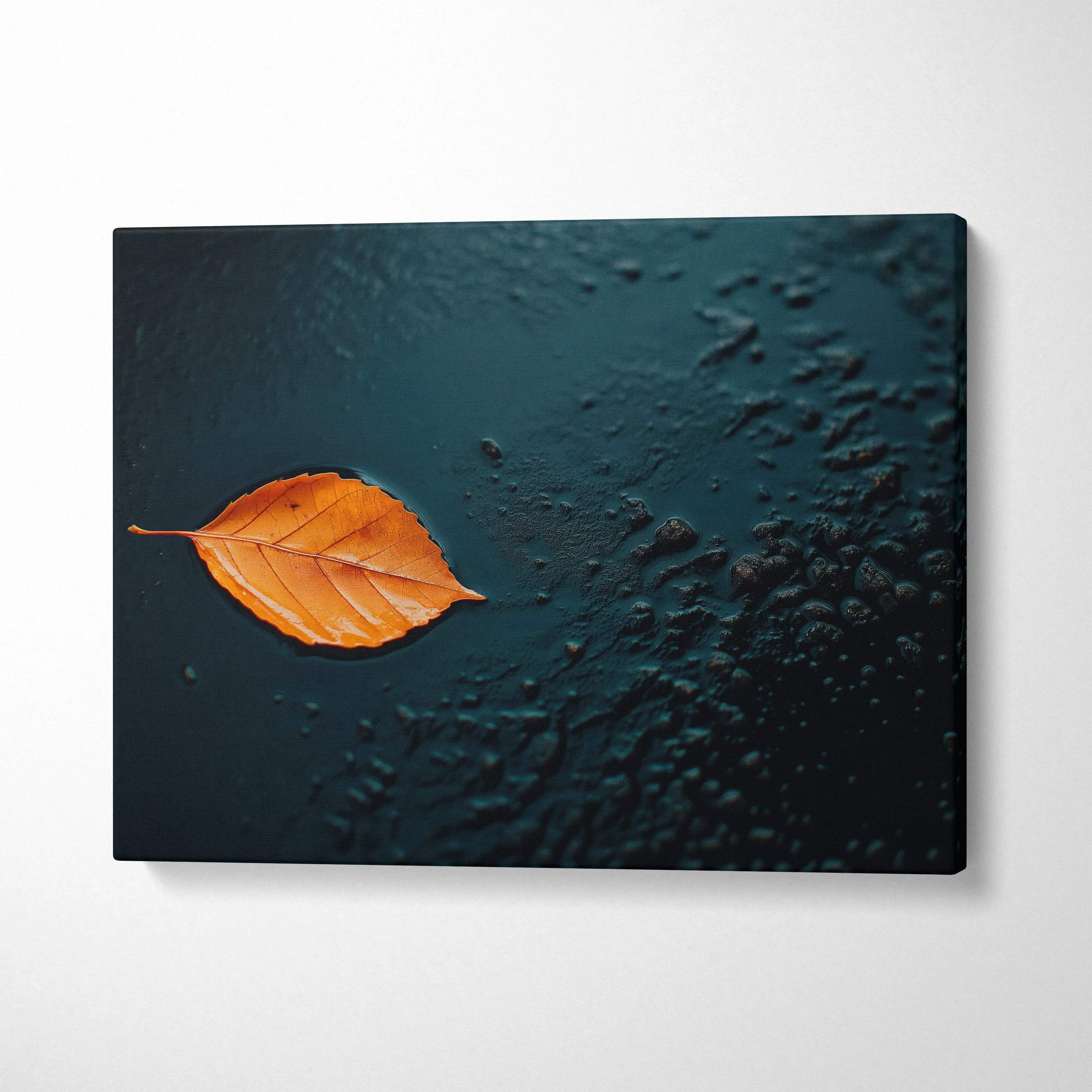 Canvas art featuring a single orange autumn leaf on textured dark blue background, minimalist wall art.