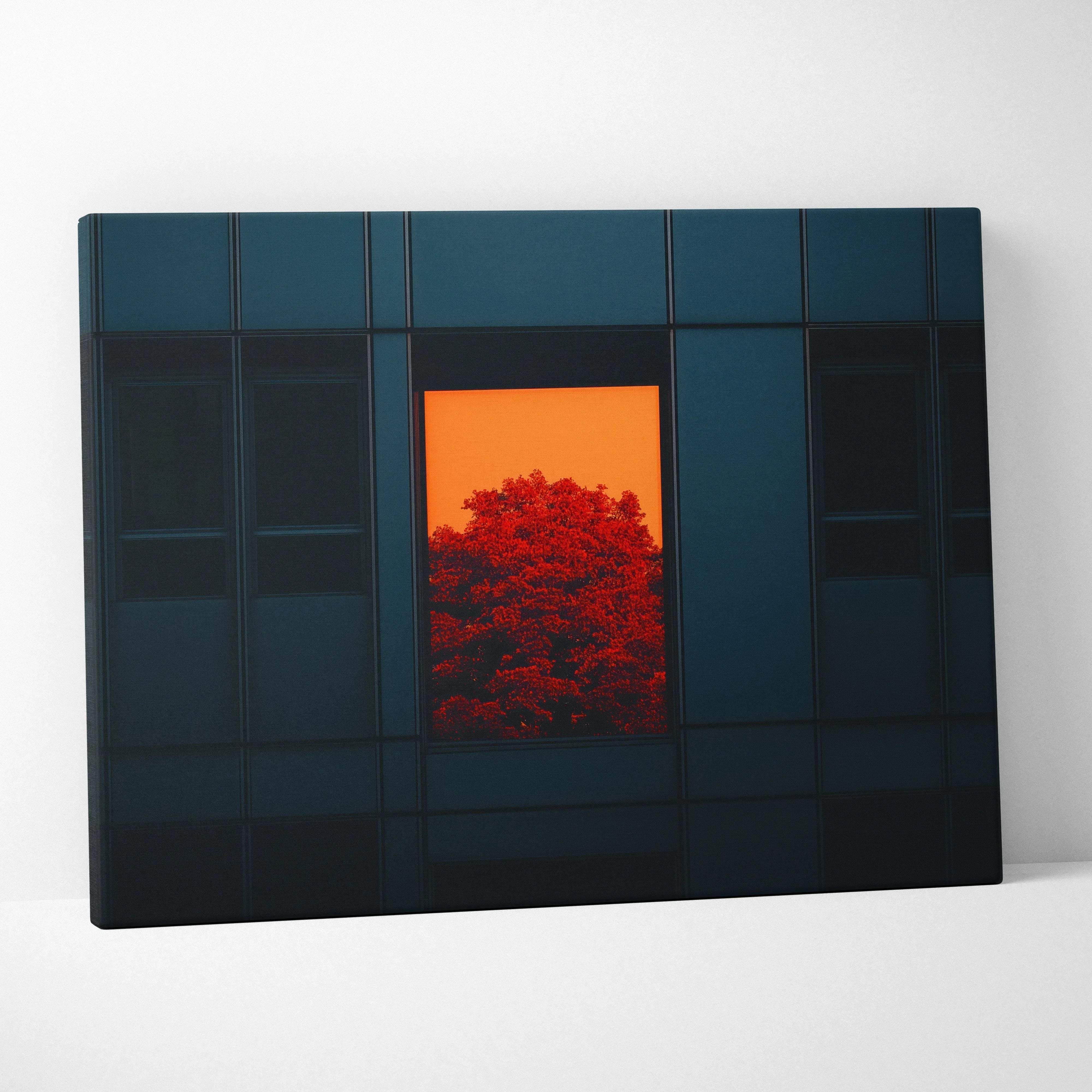 Dark blue canvas wall art featuring a vibrant orange sunset and red foliage against a modern urban building facade
