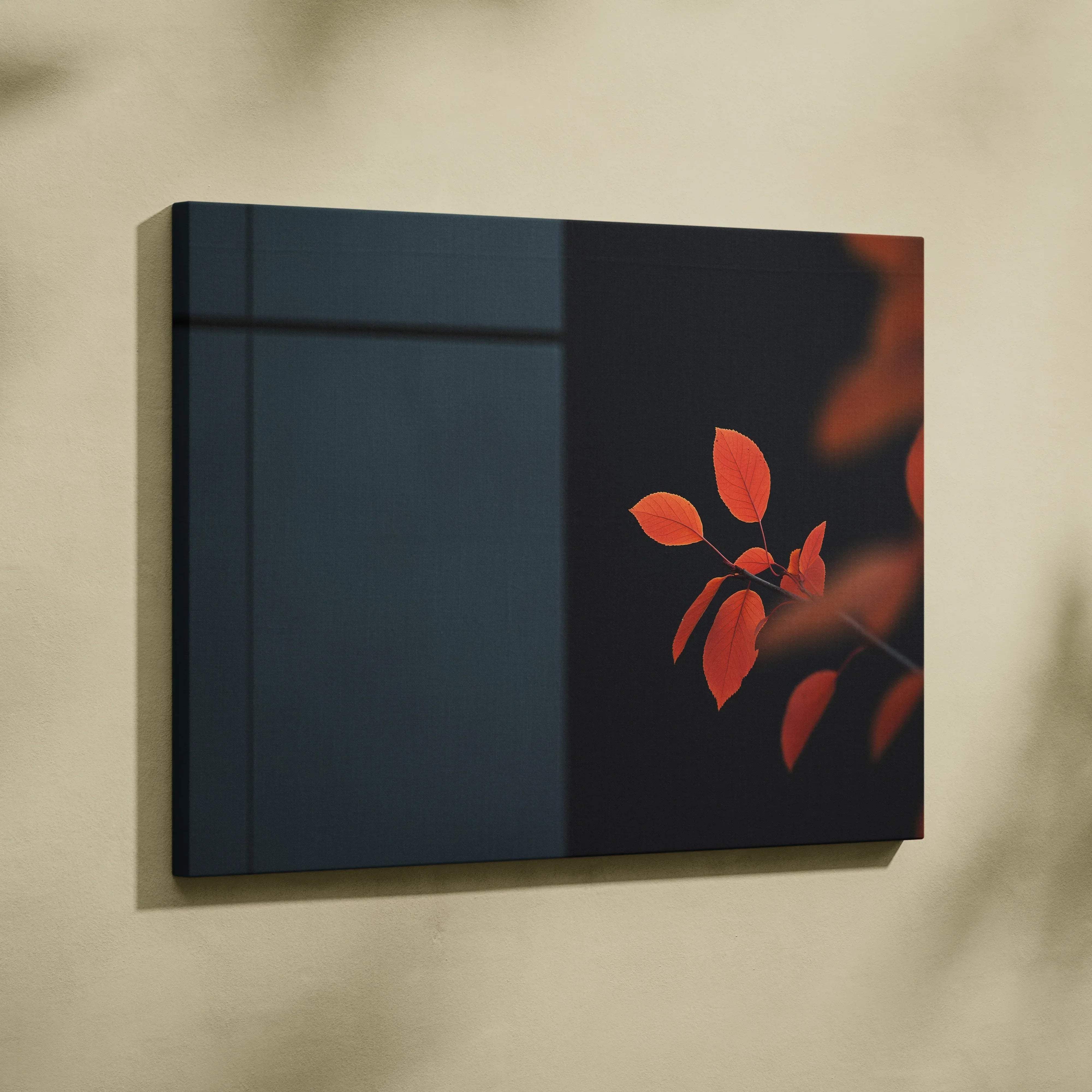 A modern canvas wall art print with vibrant warm orange autumn leaves on a minimalist moody blue and black backdrop