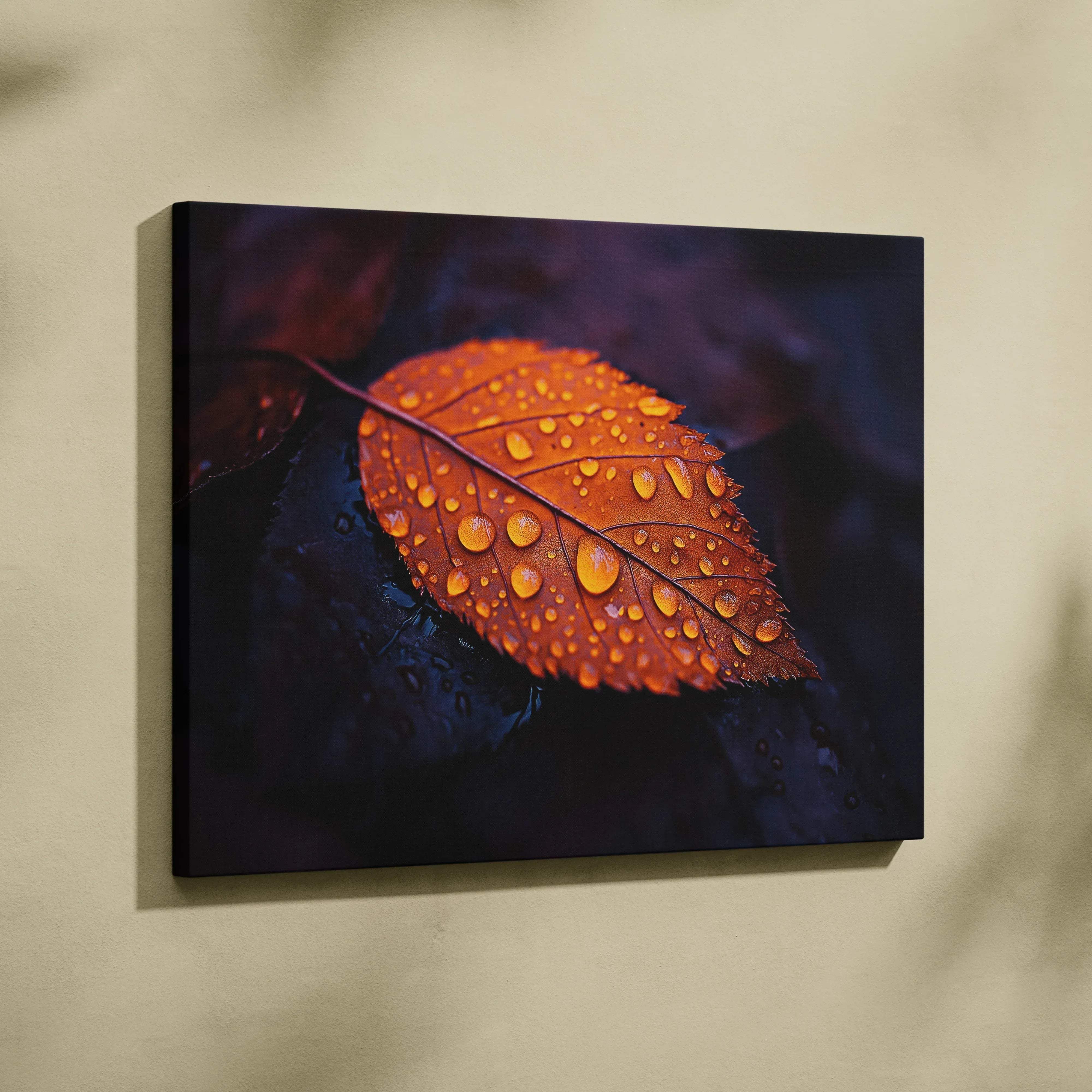 Canvas print of a vibrant orange autumn leaf with dew drops on a warm moody indigo background for wall art