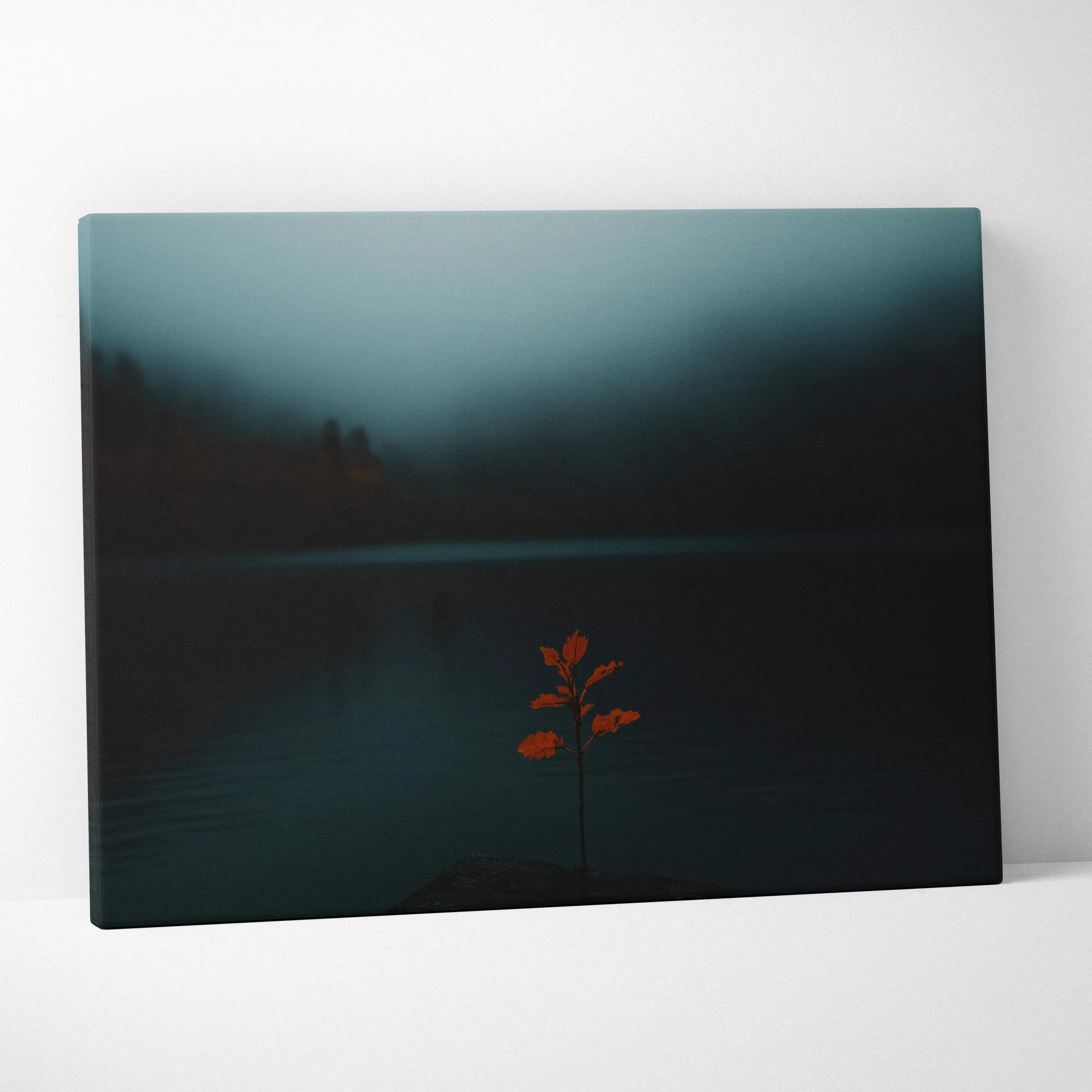 Minimalist canvas wall art featuring a solitary orange leafy branch against a moody teal and black lake backdrop