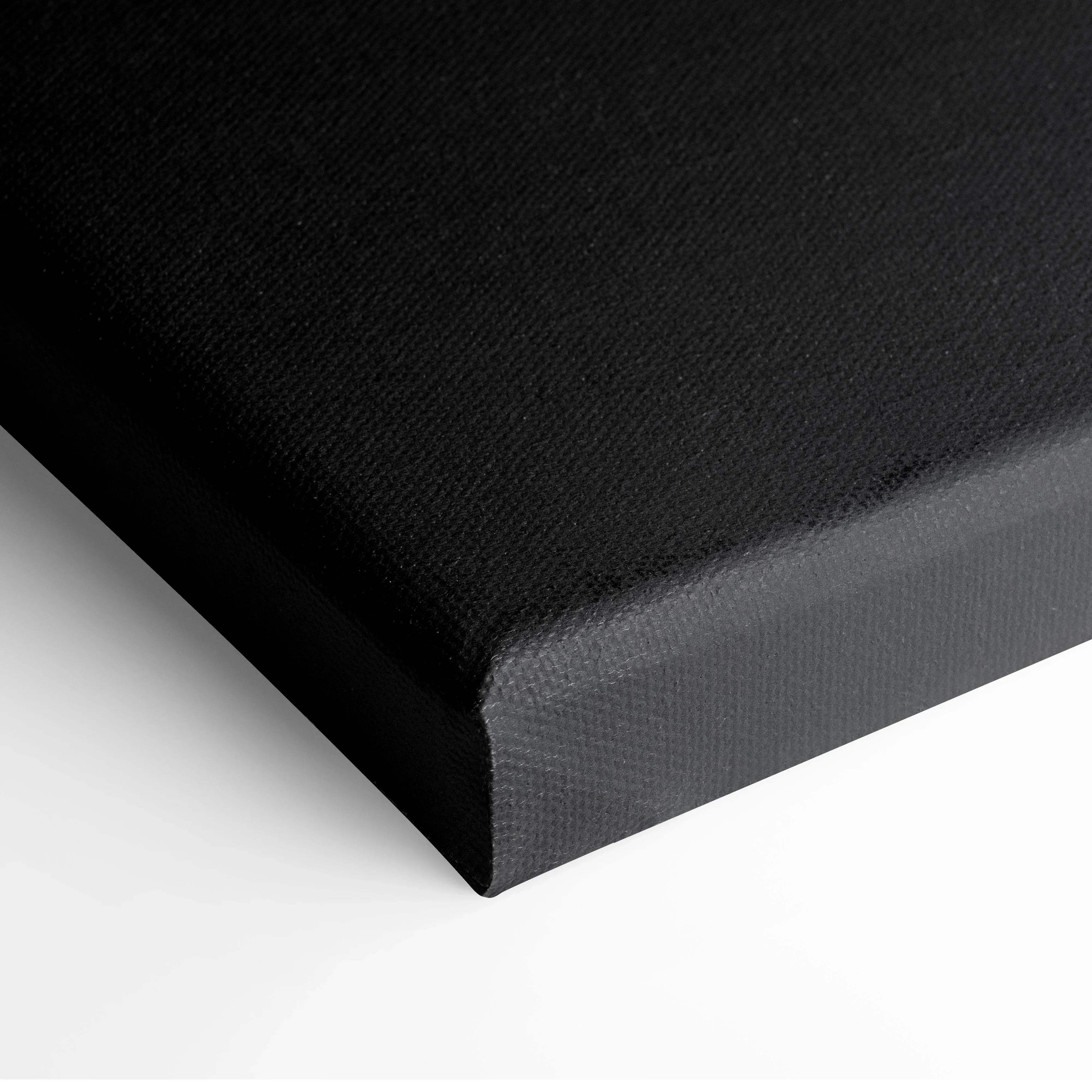 Black canvas print with textured surface and wrapped edges featuring minimalist autumn leaves in warm amber tones