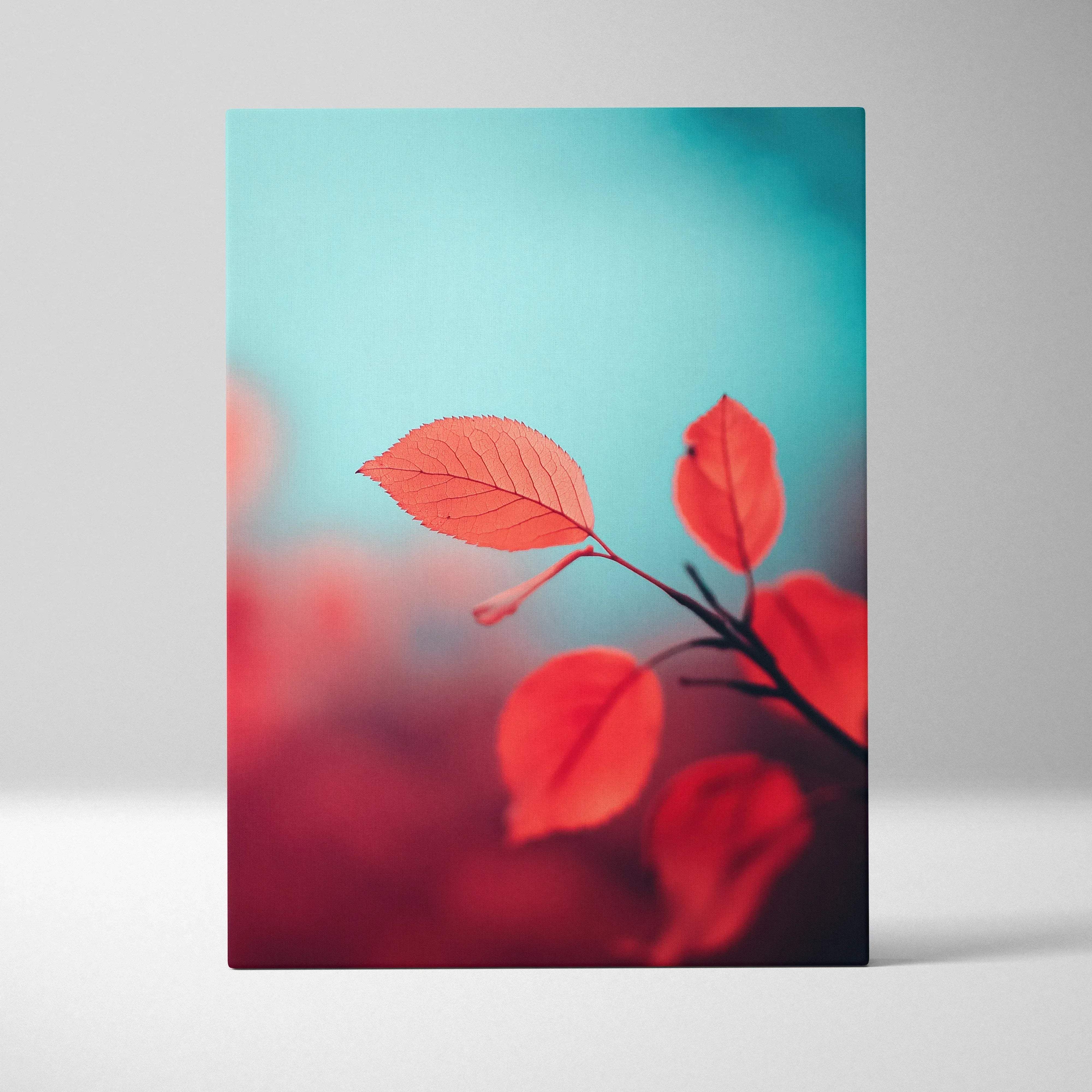 A rectangular canvas print featuring vibrant red autumn leaves on a soft teal background for living room decor