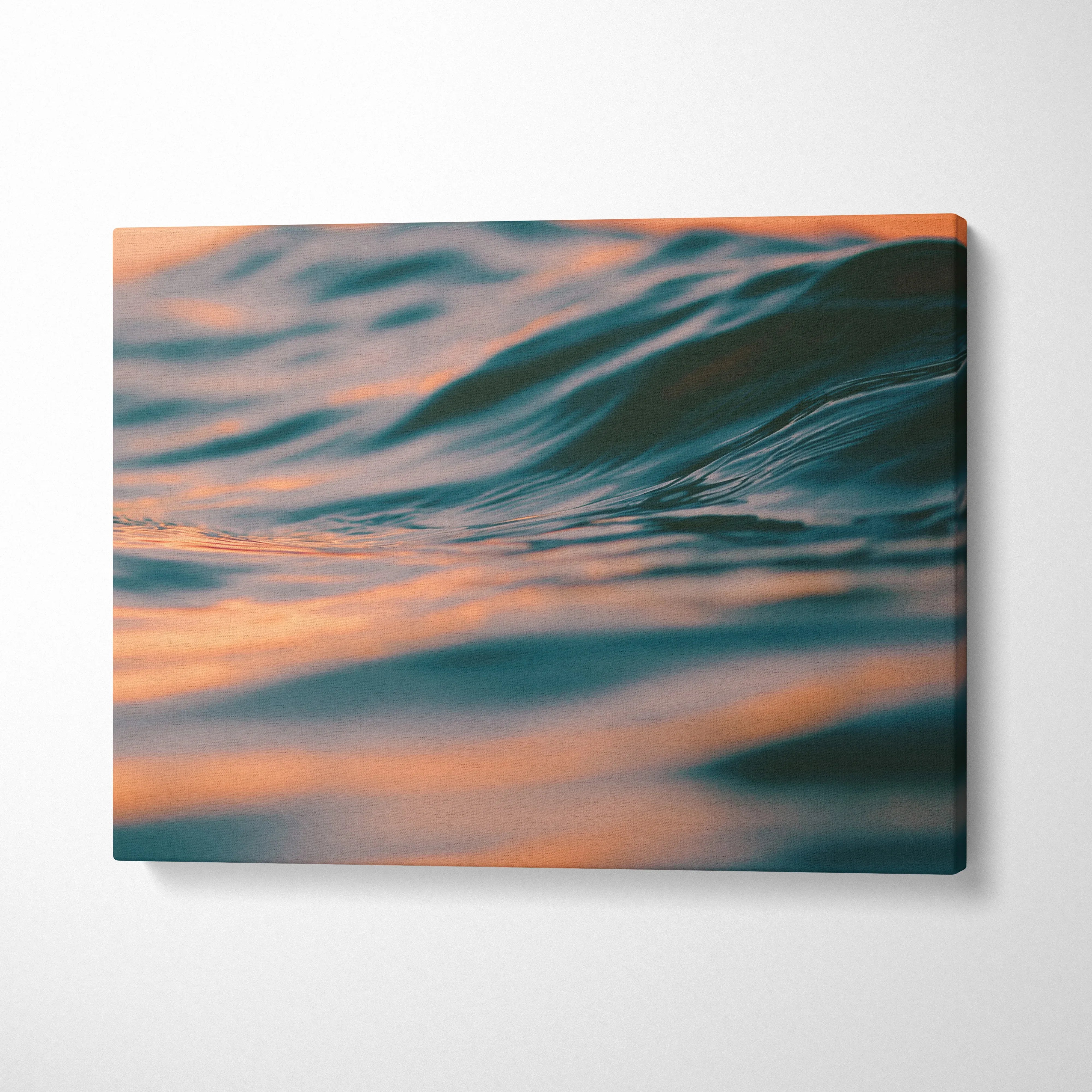 Canvas wall art featuring digital art of tropical waves at golden hour sunset with soft orange and blue tones.