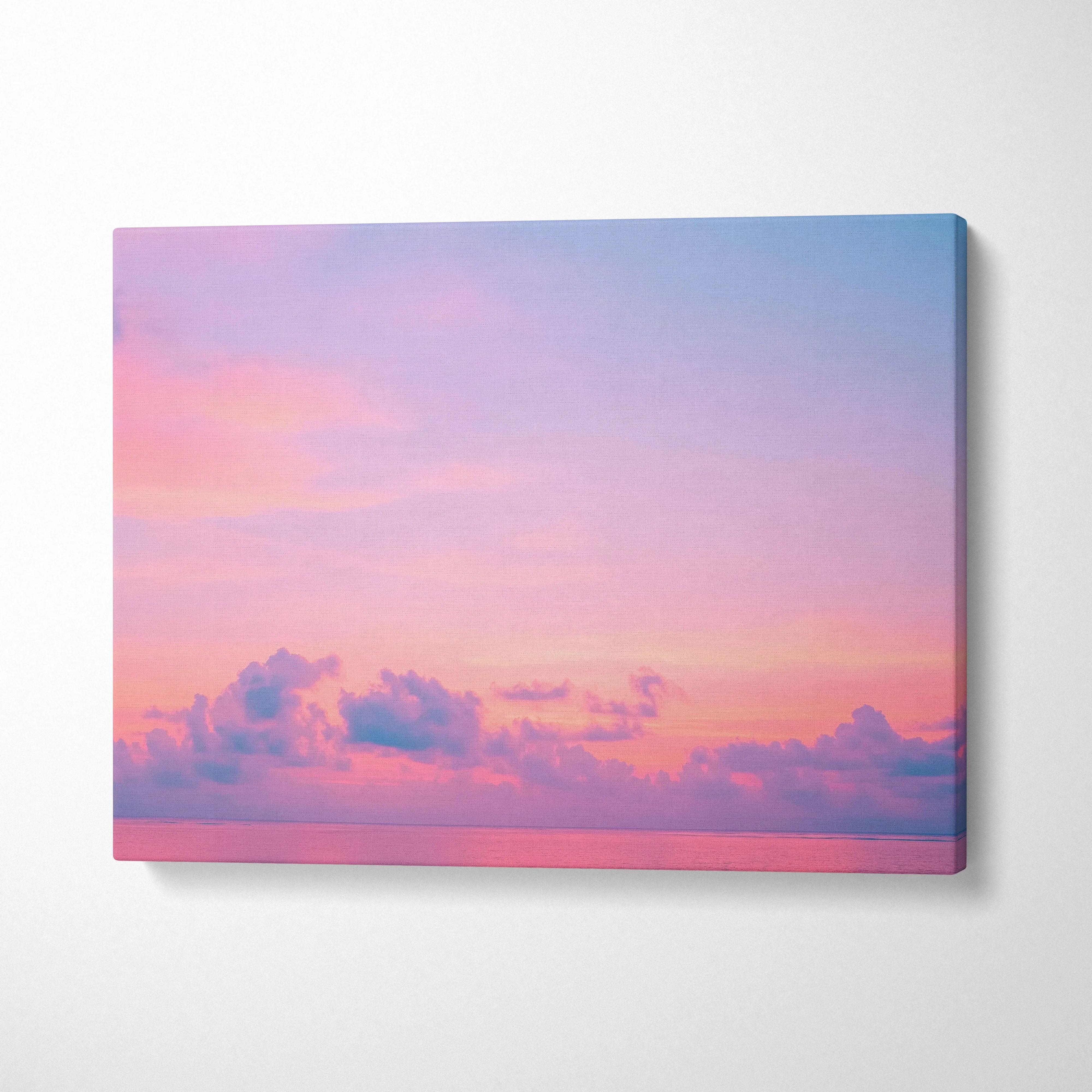 Tropical sunset ocean scene canvas wall art with pink and purple clouds decor.