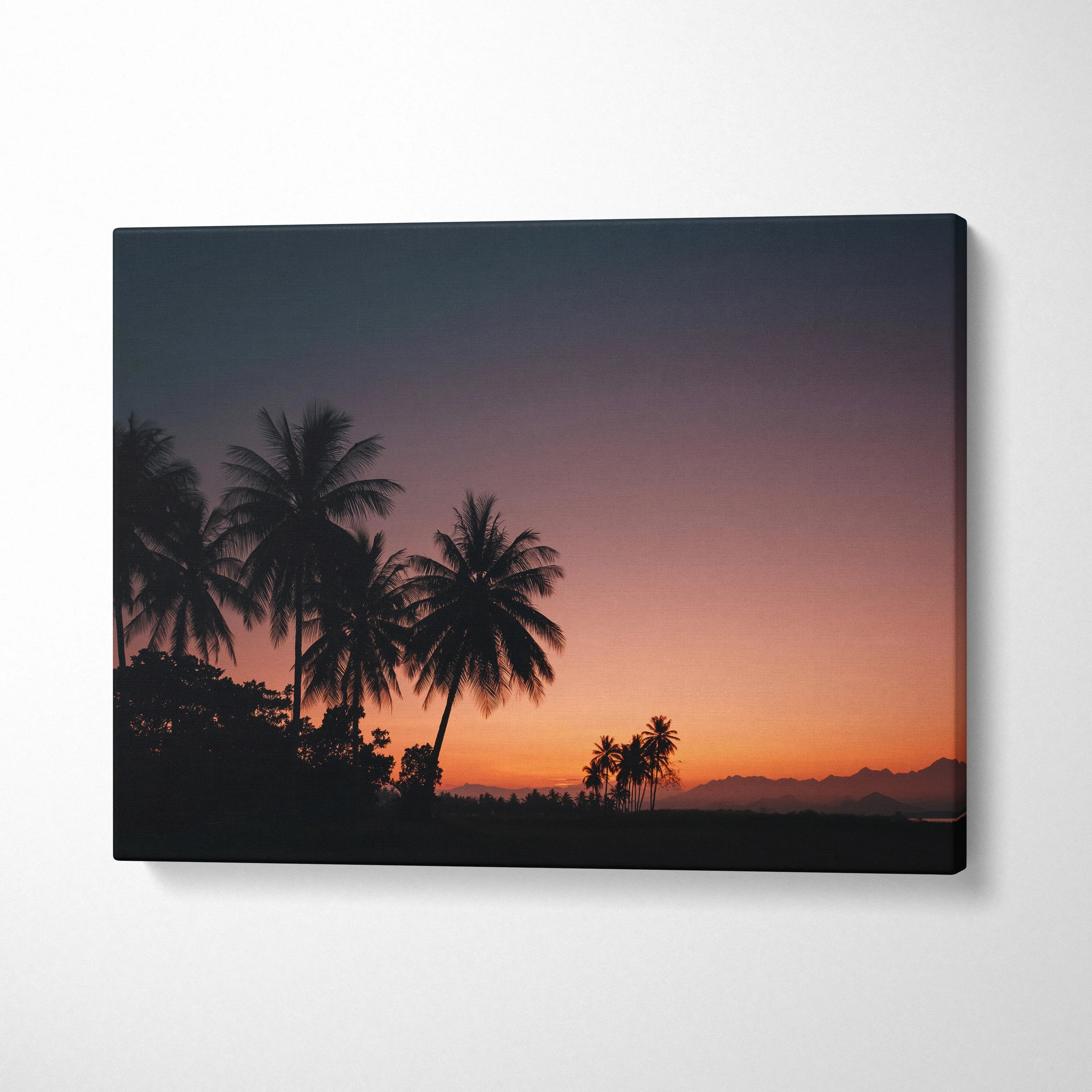 Tropical sunset canvas wall art with silhouette palm trees and dusky sky decor.