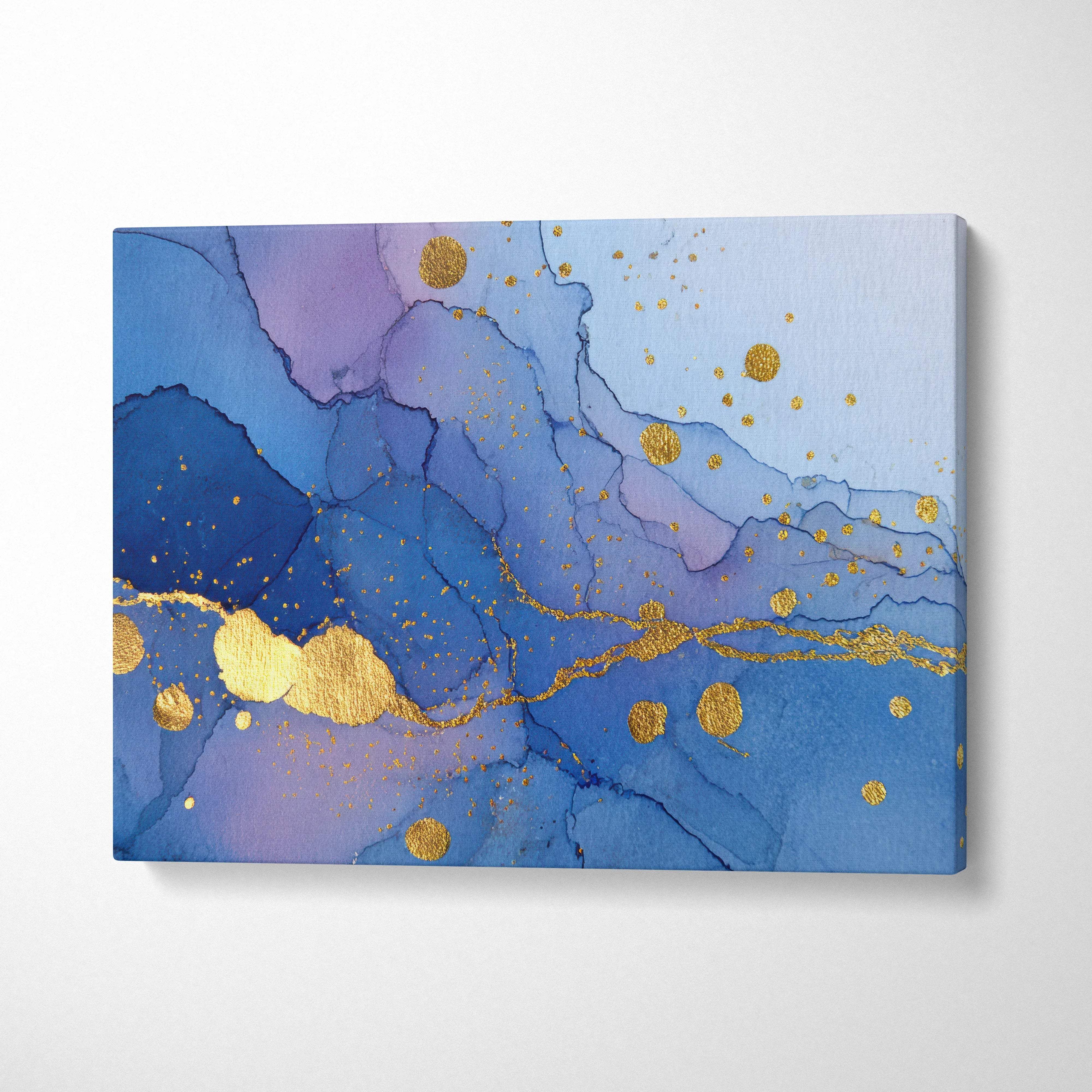 Coastal luxe abstract fluid art canvas wall art featuring blue and purple tones with gold leaf accents