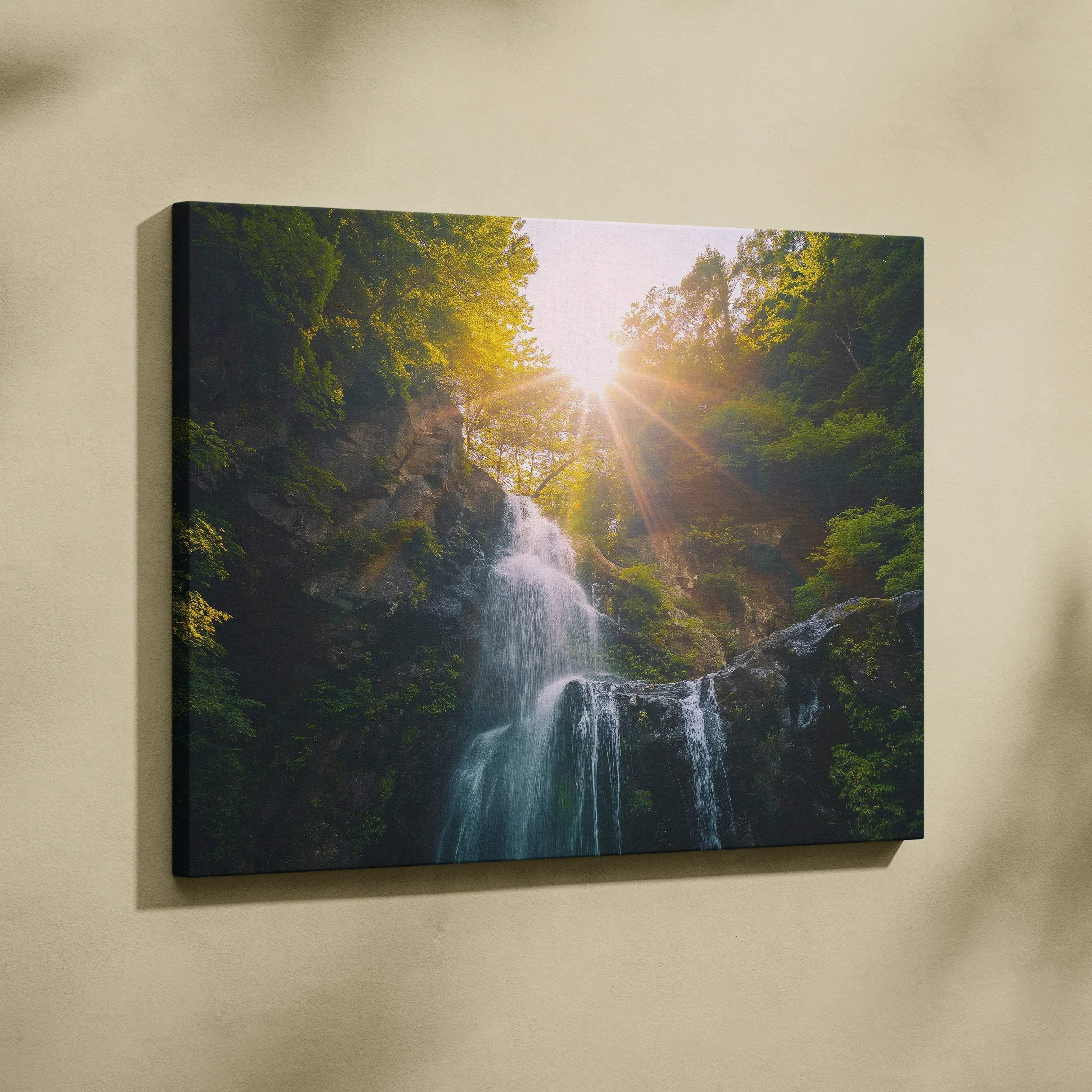 A framed canvas wall art print of a sunlit waterfall in a lush green forest capturing golden hour tranquility