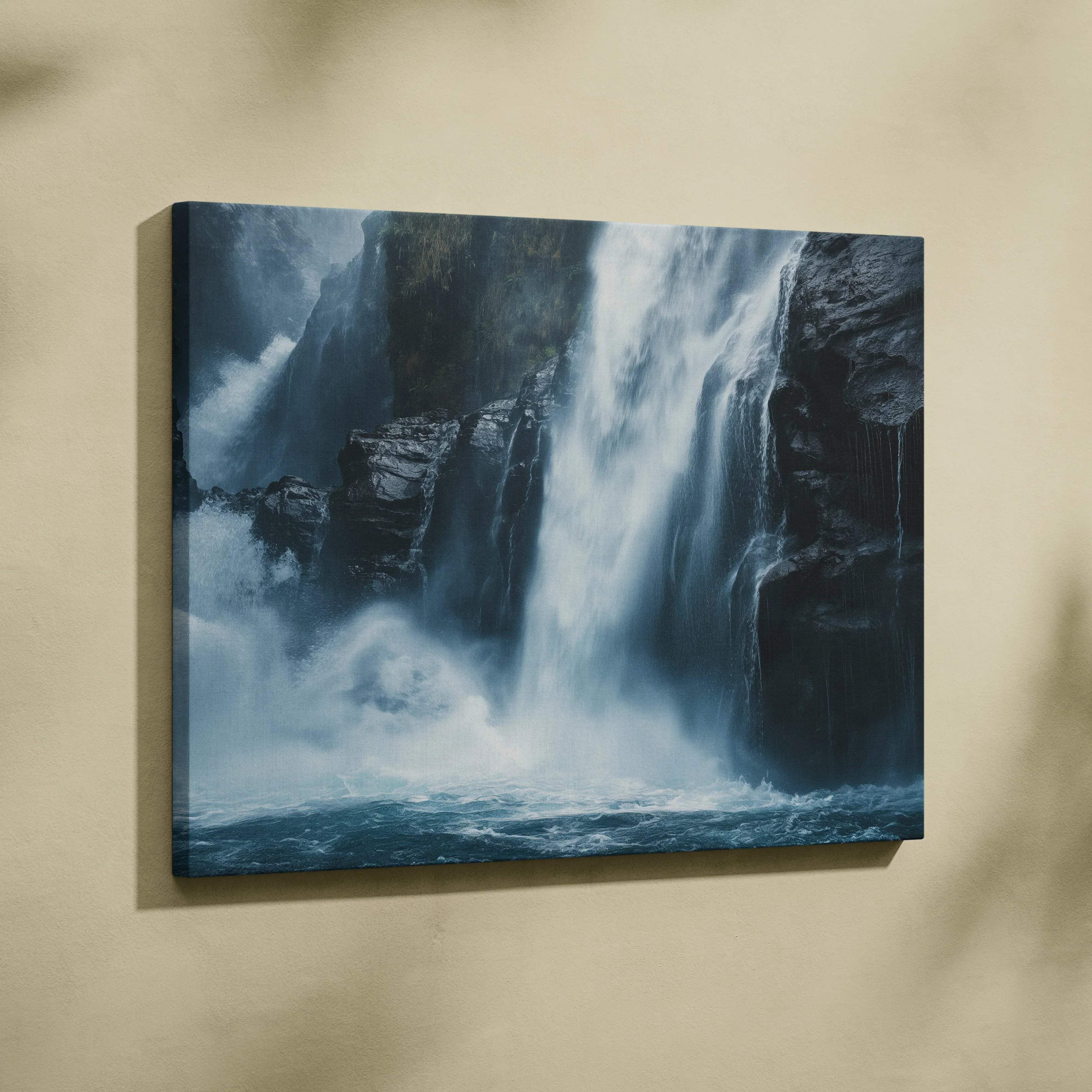 Calm nature landscape canvas wall art of a dramatic blue waterfall cascading over dark rocky cliffs with mist