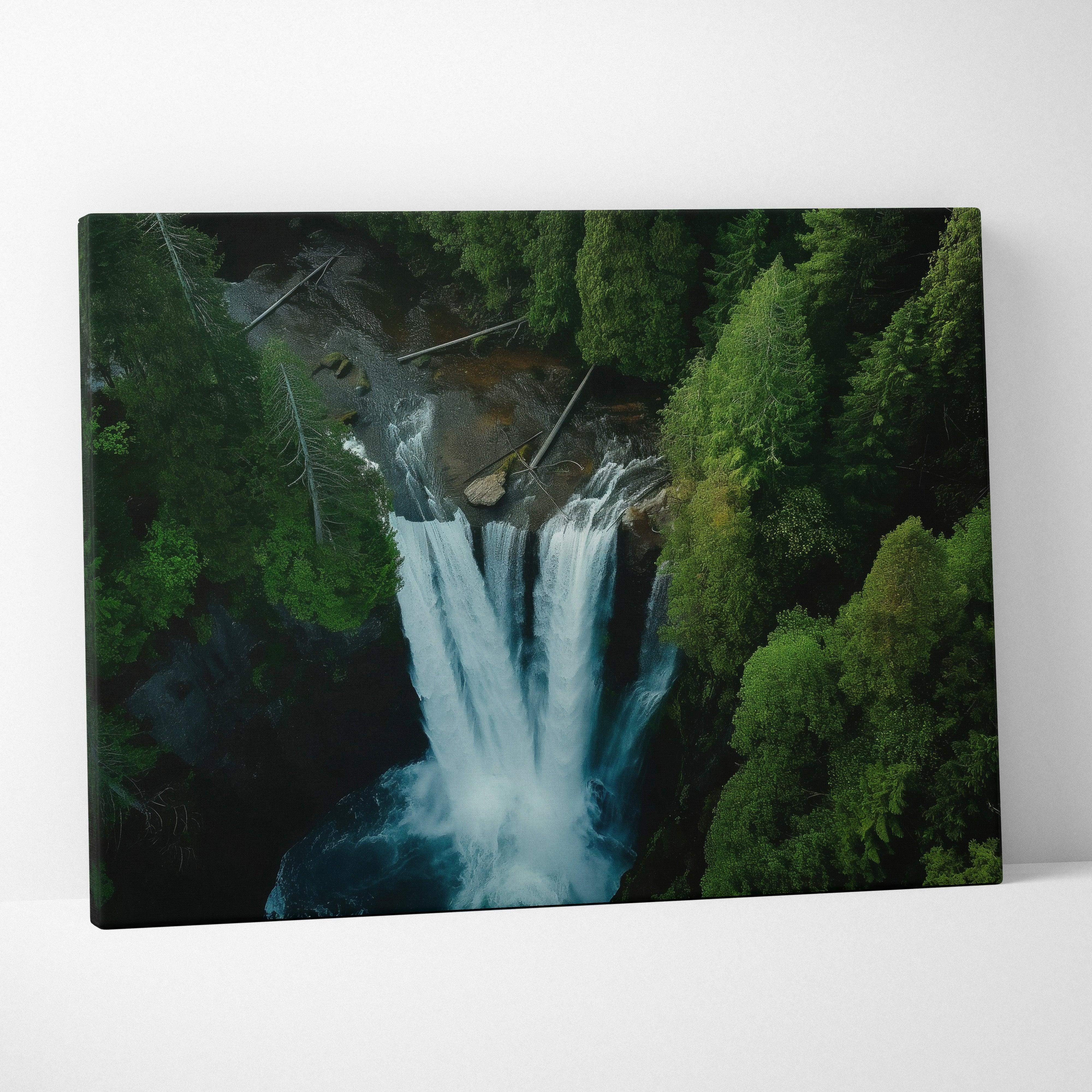 A canvas print of a dramatic white waterfall cascading through dense green forest on dark rocks for wall art decor