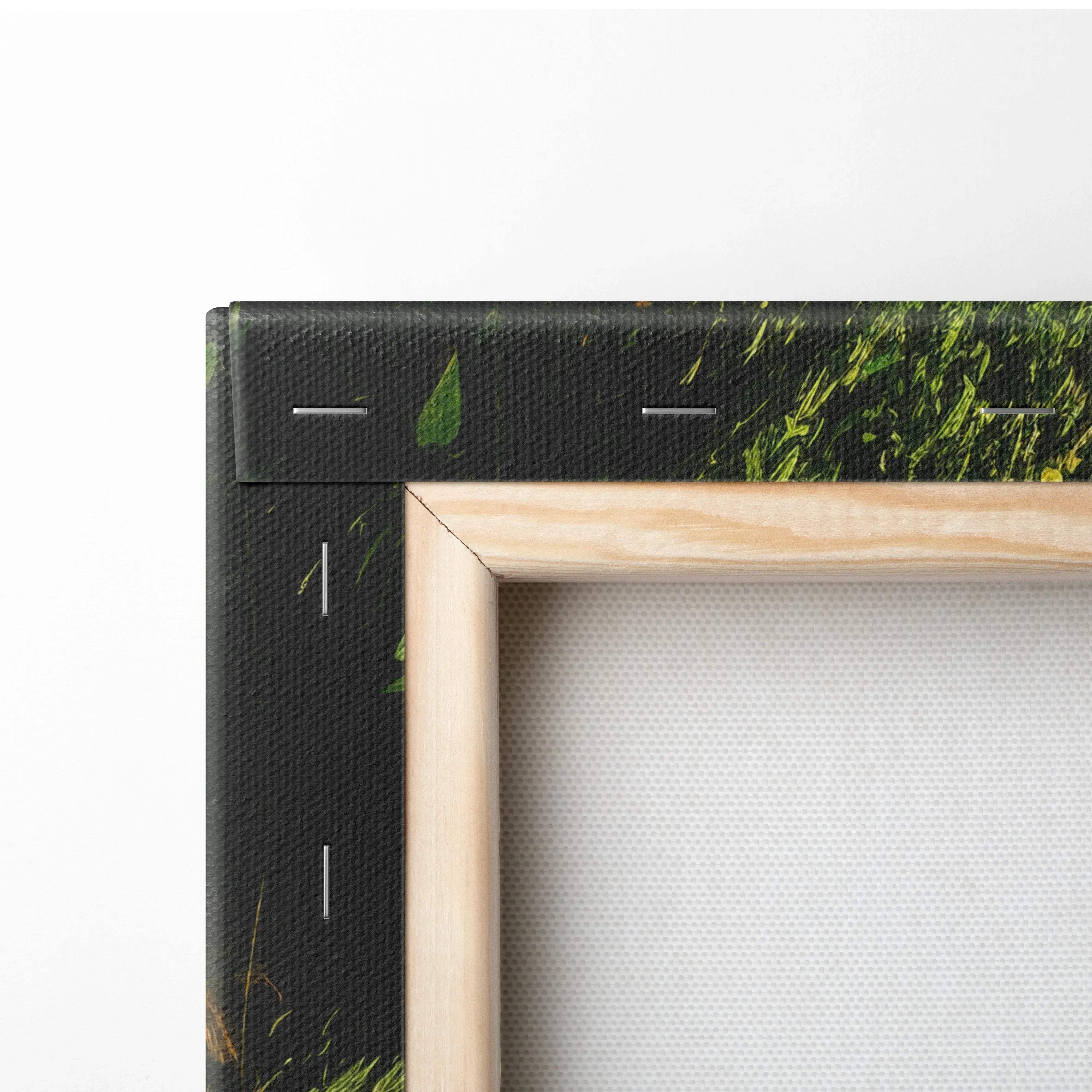 Light wood framed canvas print with textured black border featuring a lush green grassy nature landscape scene