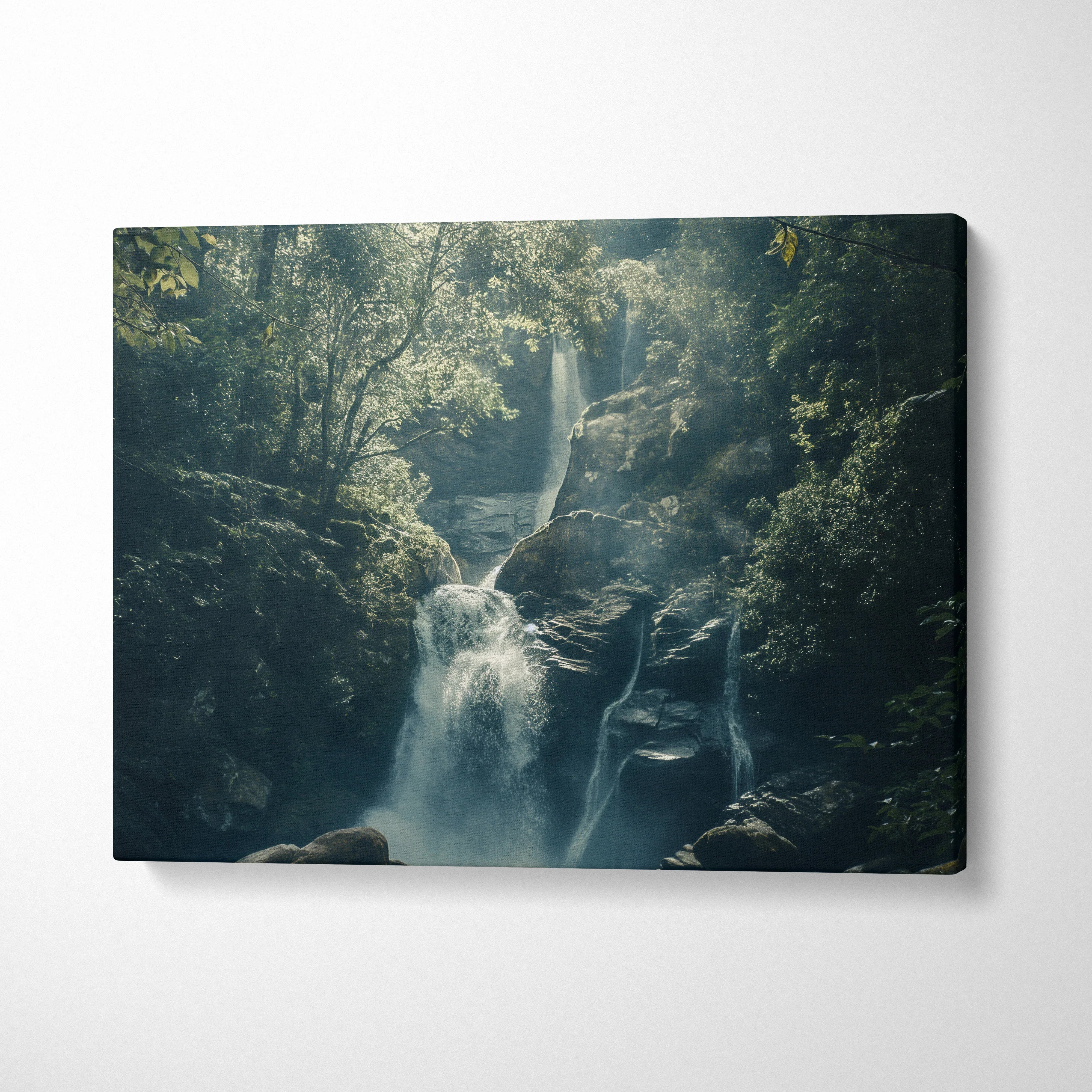 Waterfall in a forest canvas wall art with misty blue and green nature decor tones.