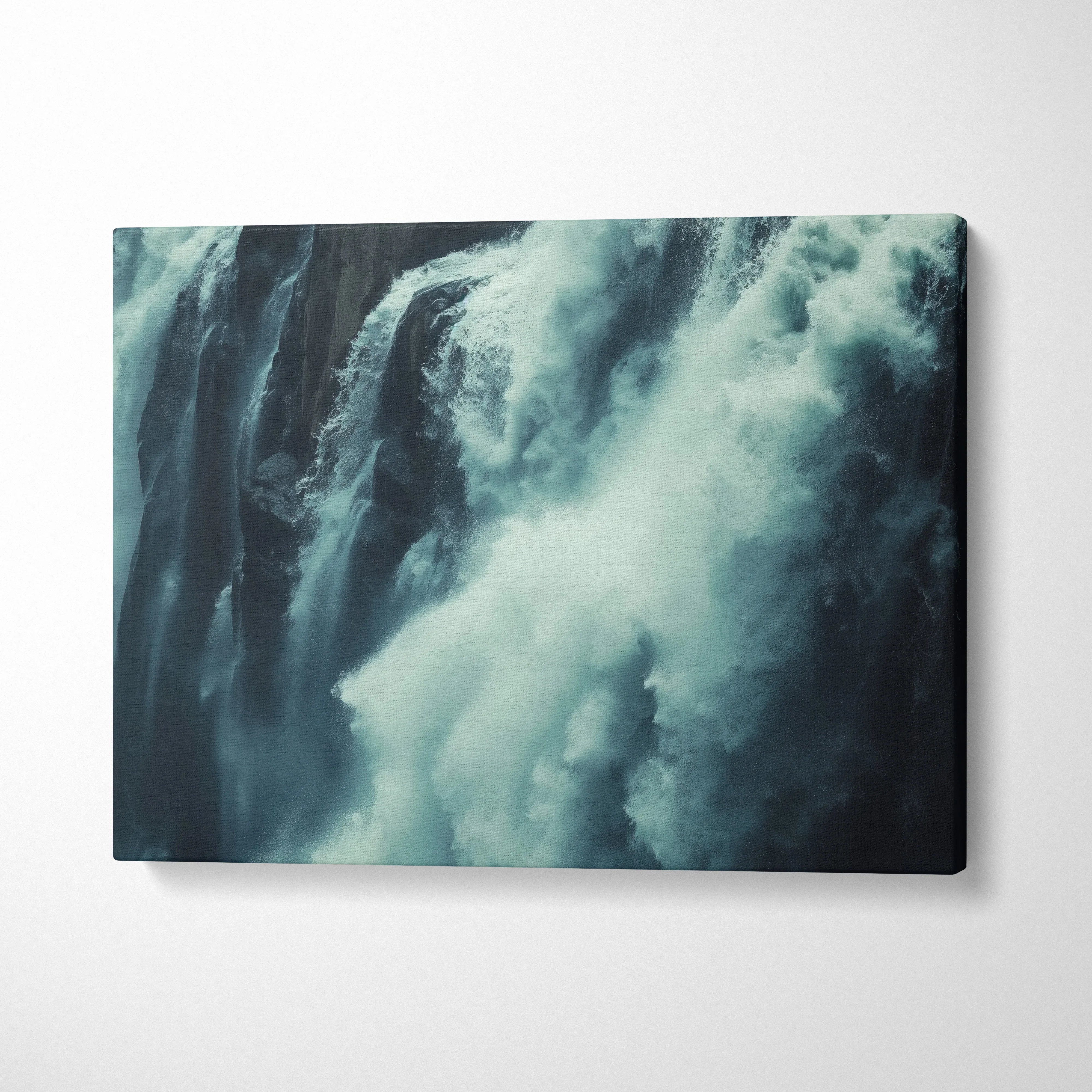Waterfall close-up canvas wall art with rushing water in dark blue tones, nature decor.