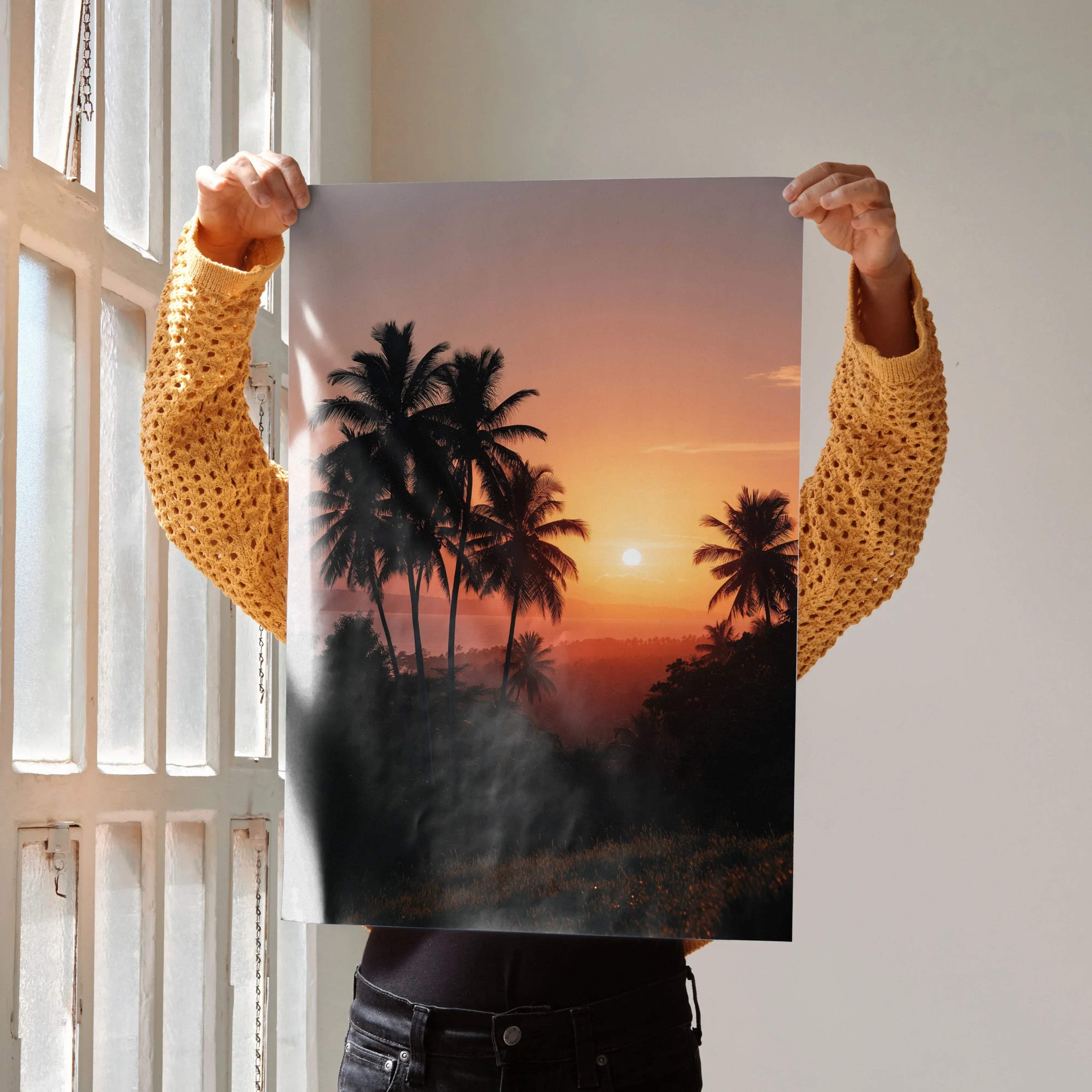 A vertical rectangular wall art poster featuring a tropical beach sunset with silhouetted palm trees and orange pink sky