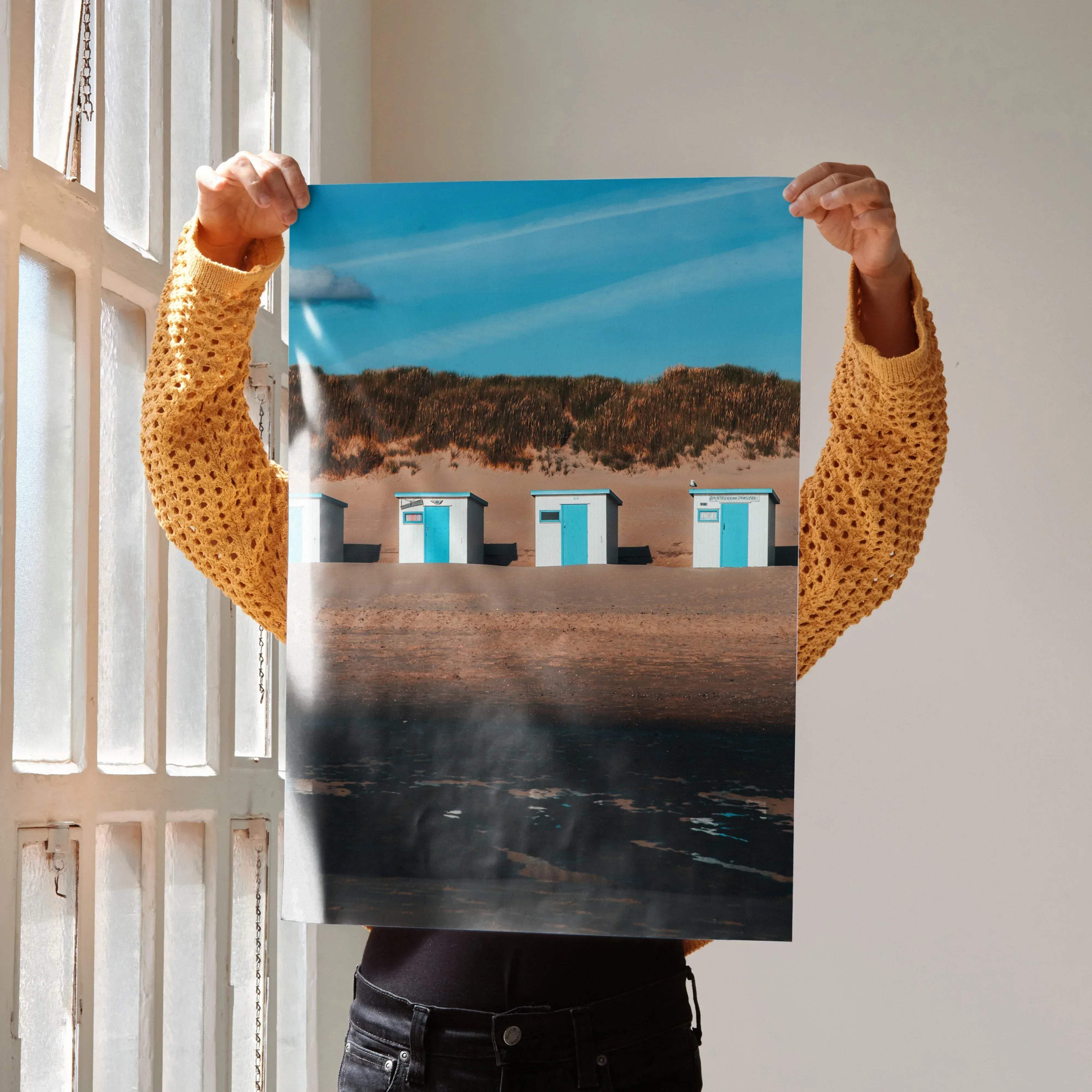 Serene beach landscape wall art poster with three light blue beach huts on sandy dunes under a bright sky