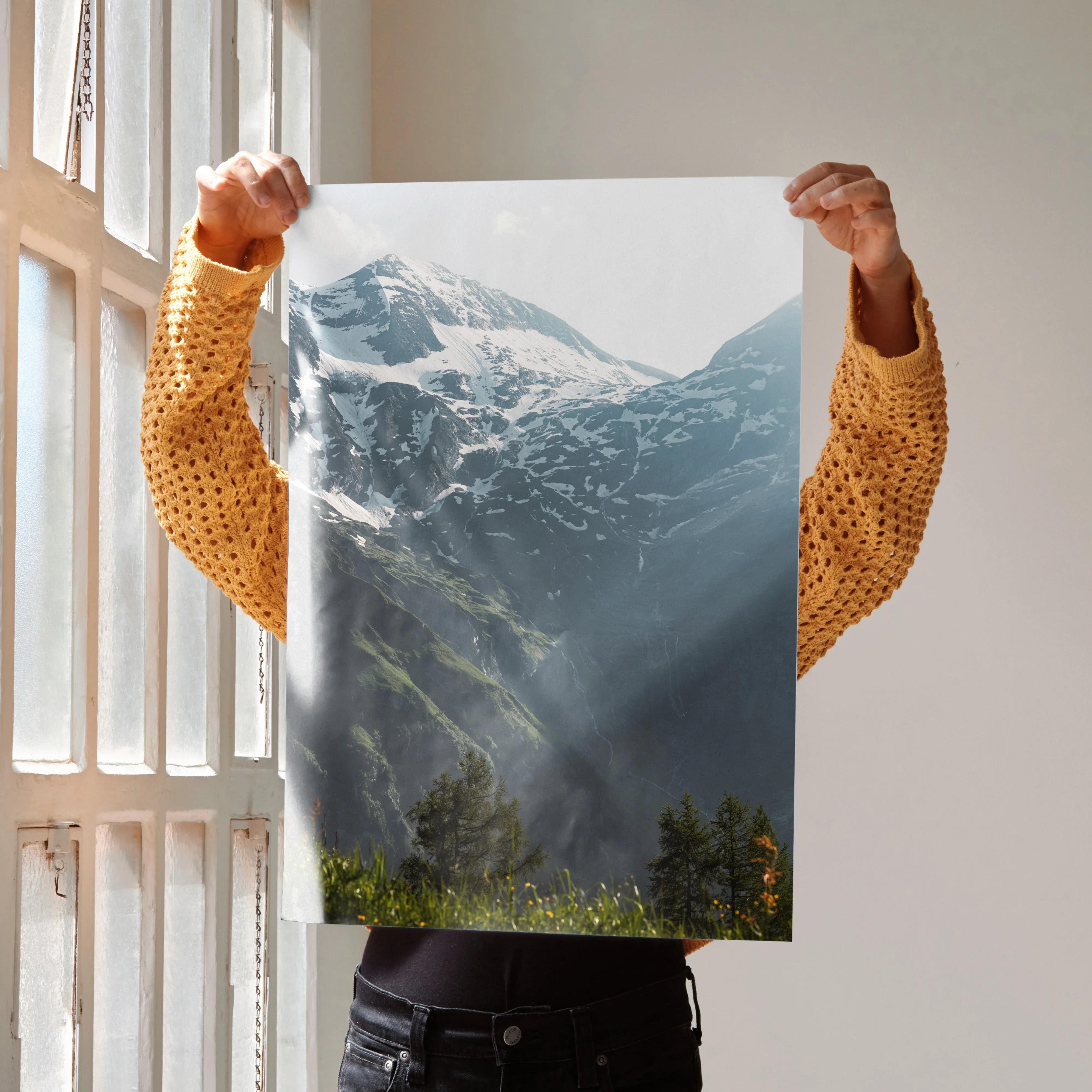 Vertical wall art poster featuring snow-capped mountains with sunlight rays and green forest foreground.