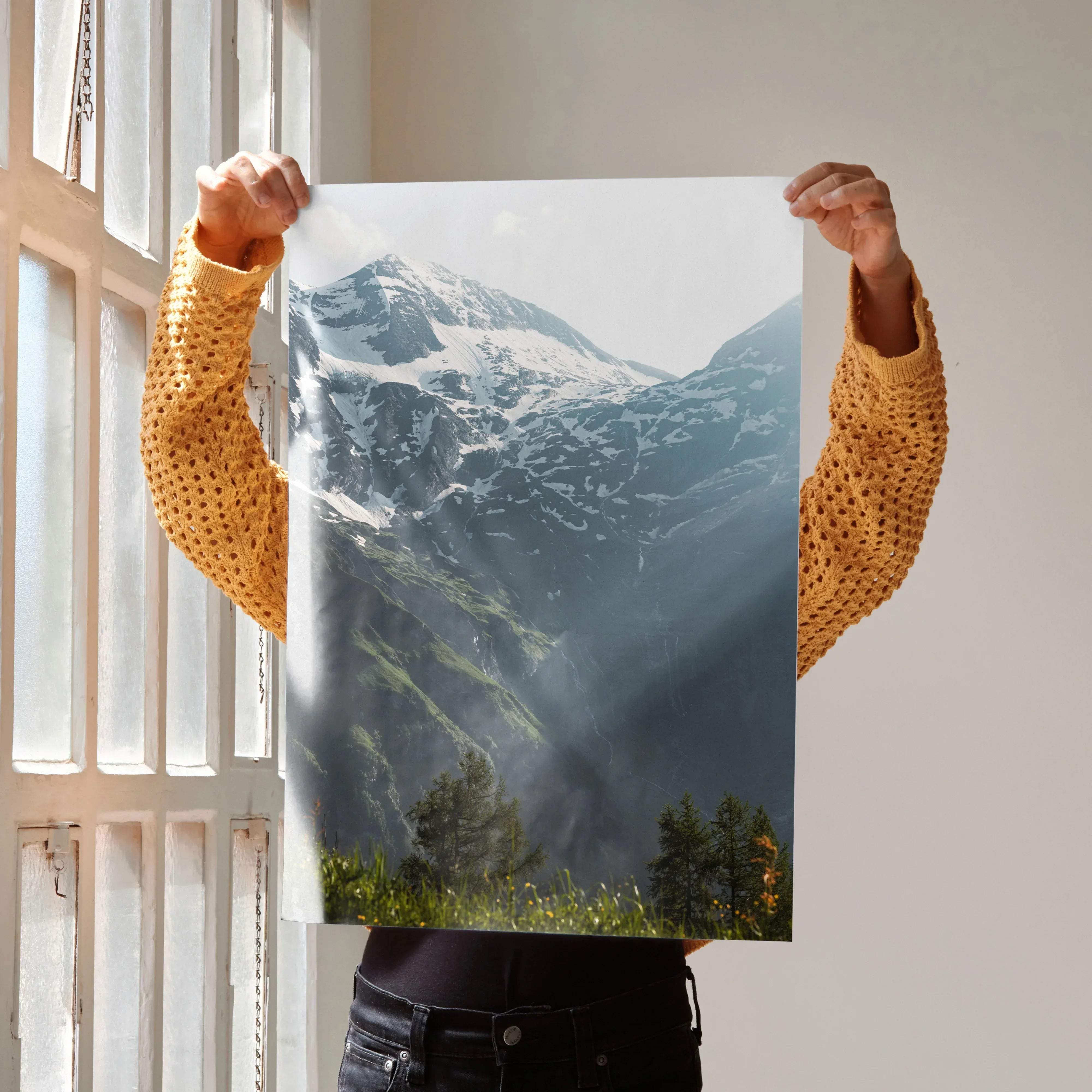 A rectangular high-resolution photographic print featuring snow-capped mountains with green forested slopes vertical wall art