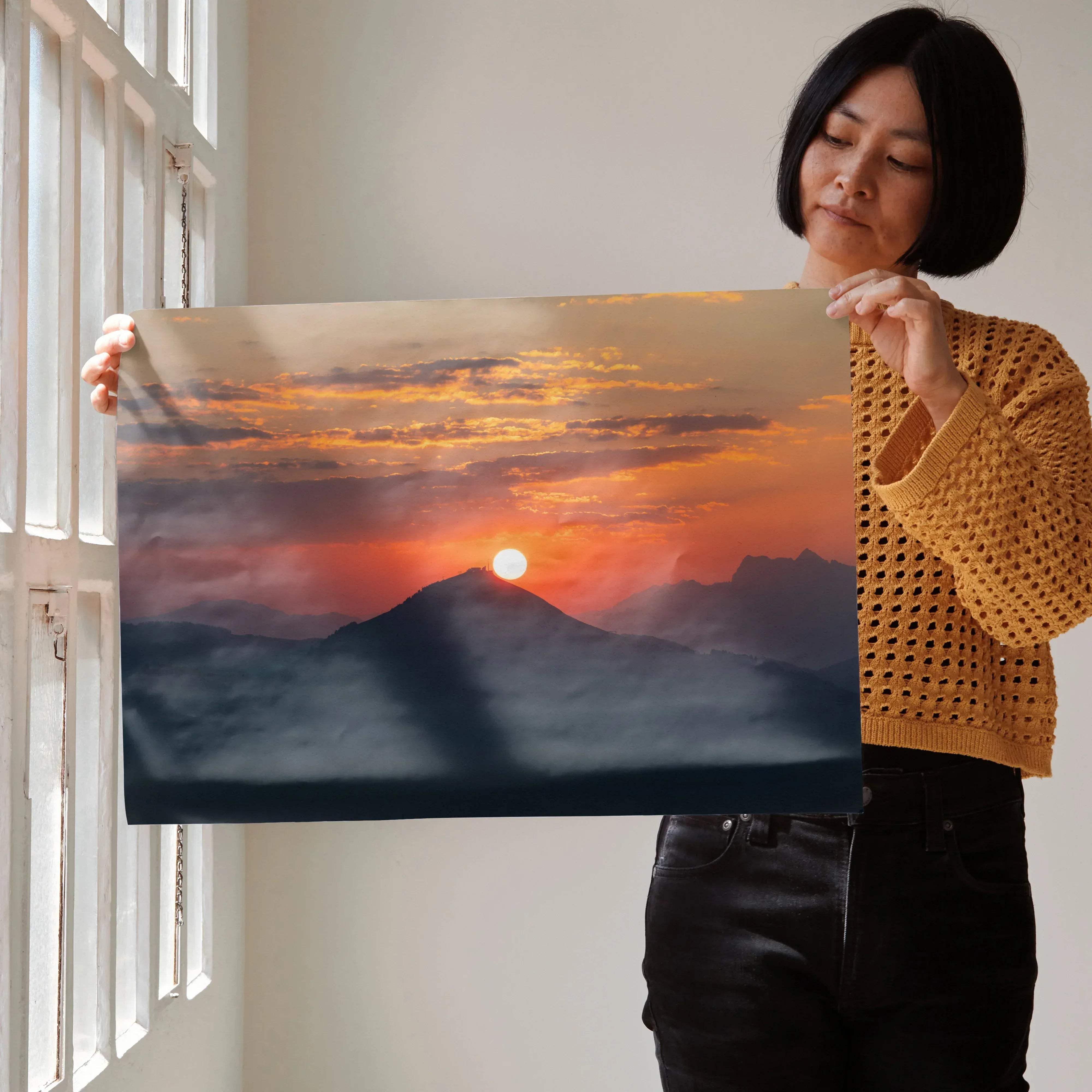 A rectangular canvas print of vibrant mountains sunset wall art with warm orange pink and deep blue hues