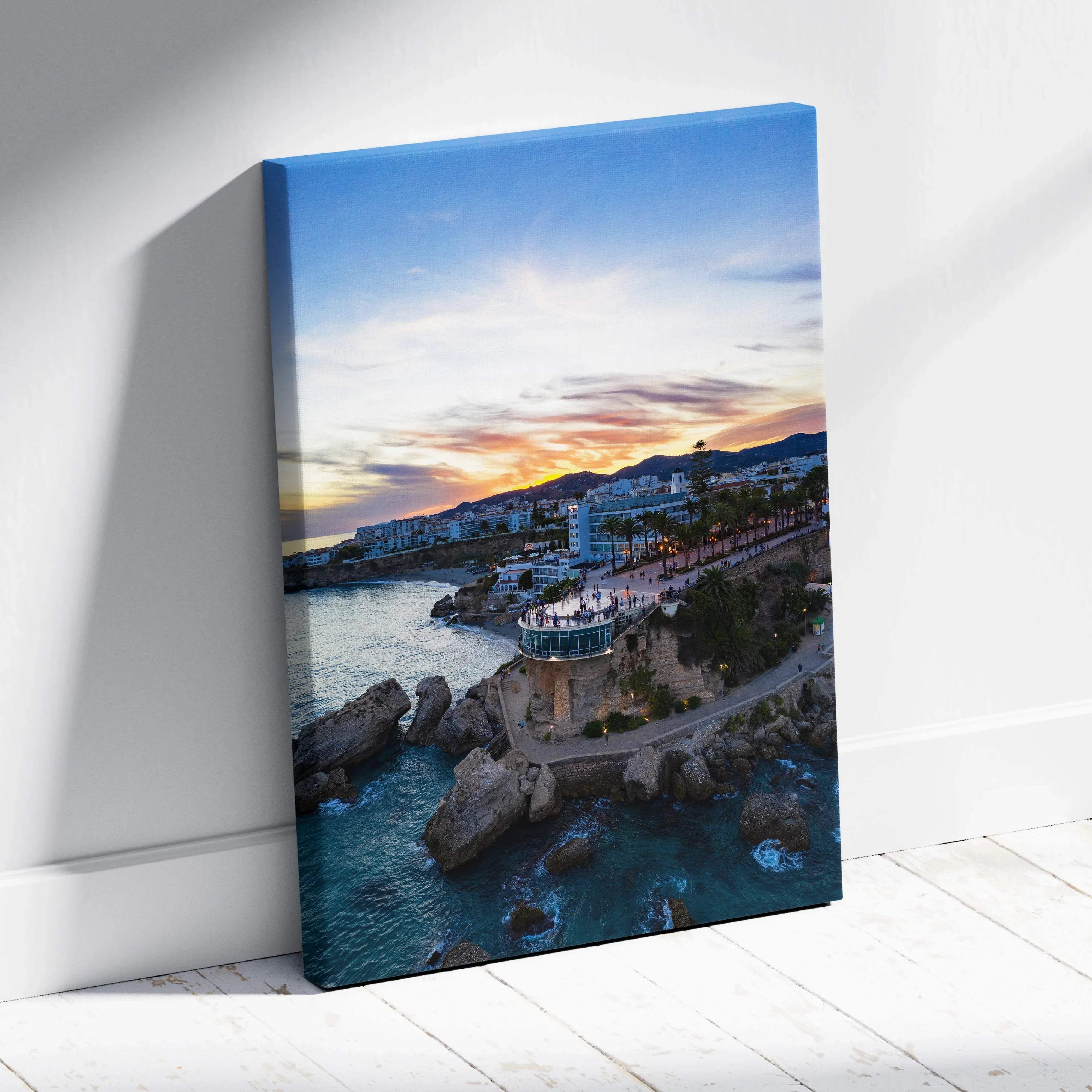 Vibrant sunset over coastal city skyline canvas wall art depicting turquoise waters white buildings and rocky cliffs