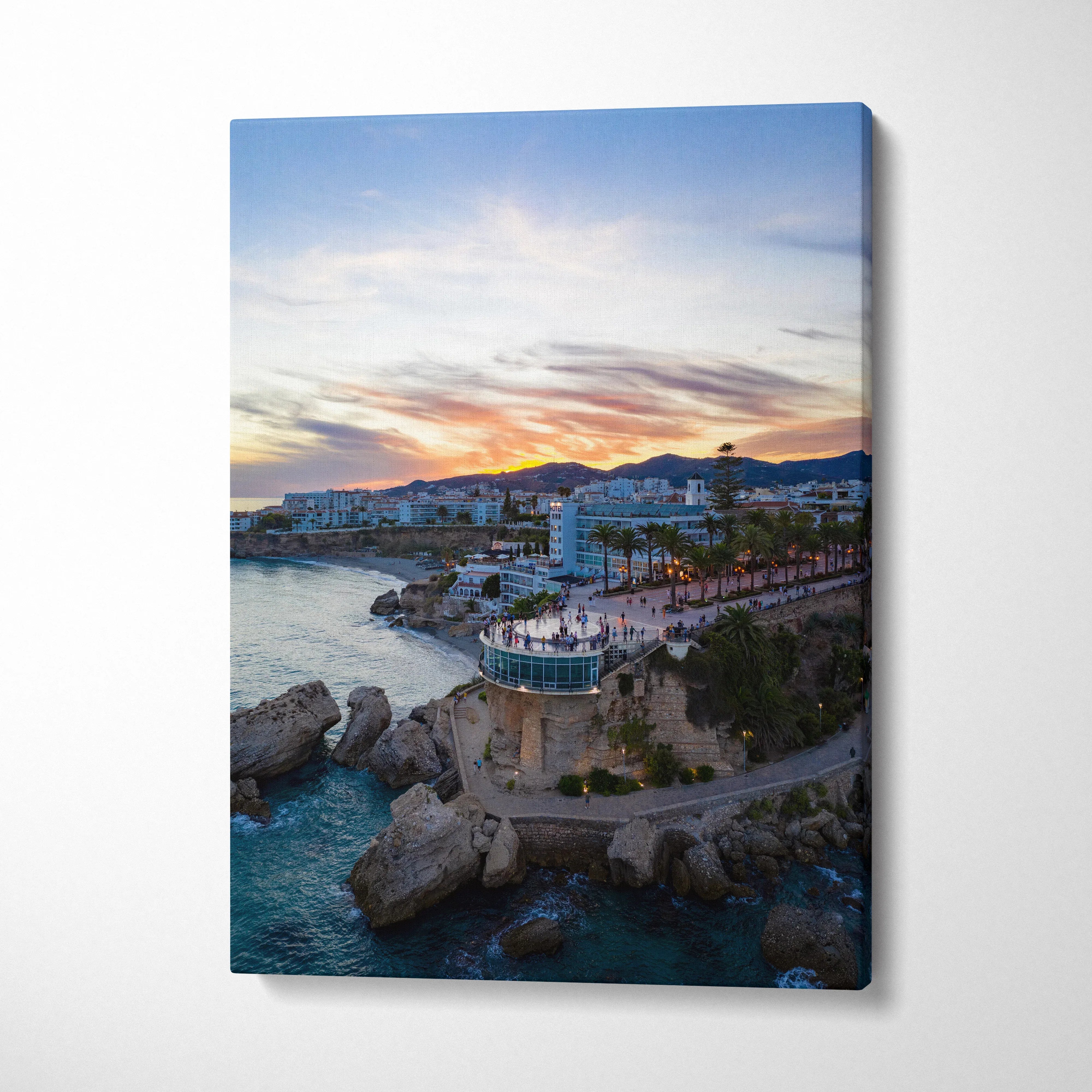 Canvas wall art featuring a vibrant city skyline at sunset with colorful sky and coastal buildings.