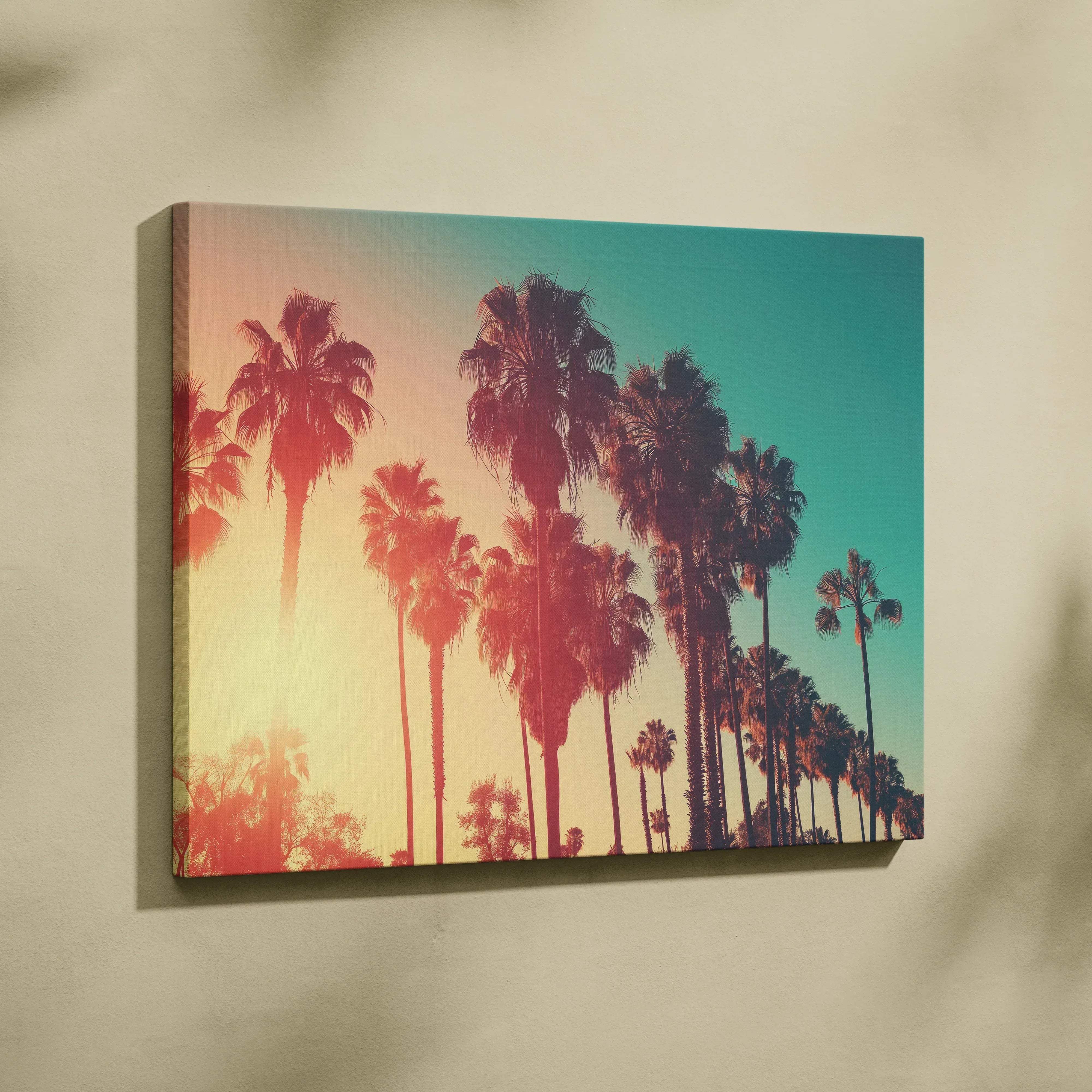A vibrant canvas wall art featuring silhouetted palm trees against a warm amber to teal gradient sky for living room
