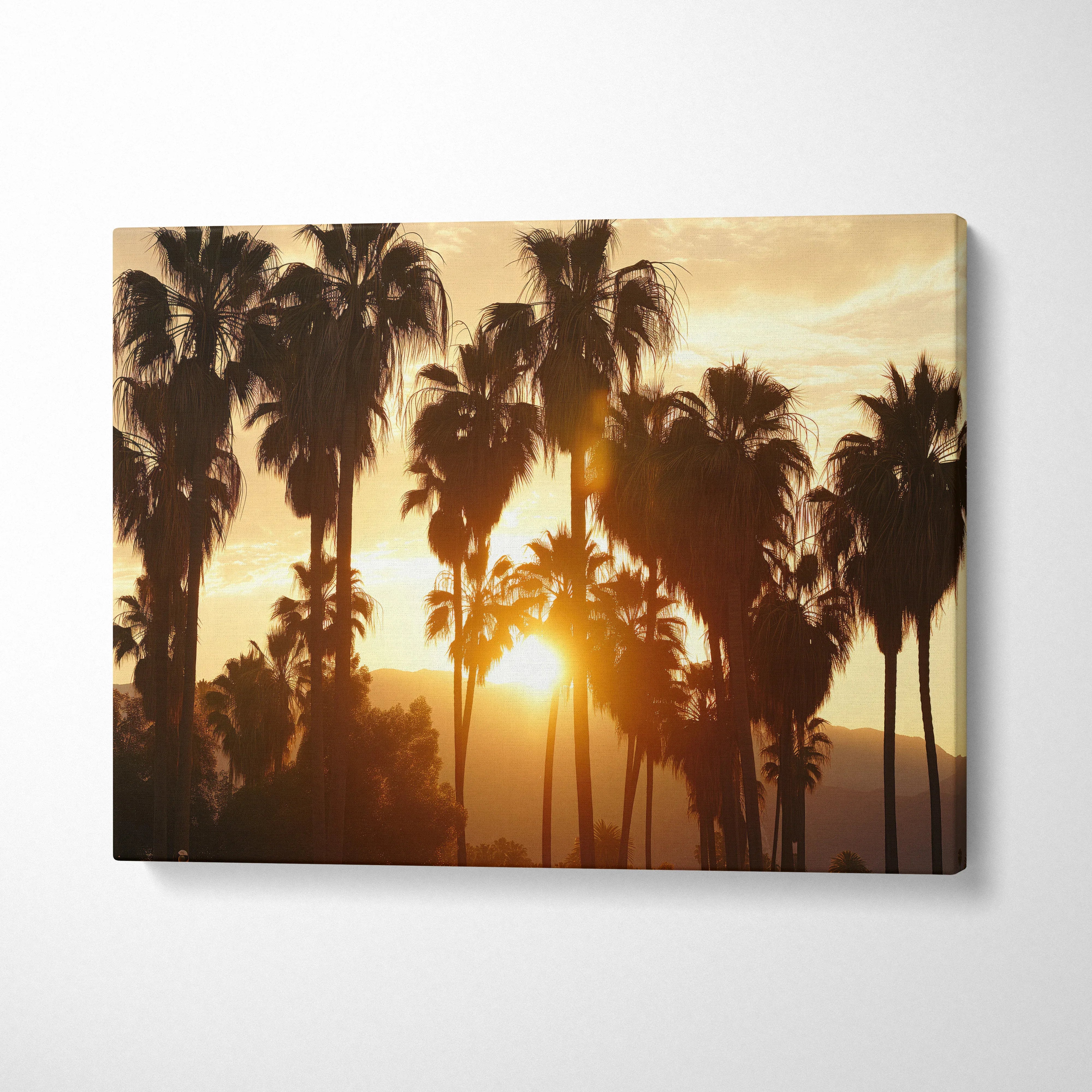 Canvas wall art featuring tropical palm tree silhouettes against a golden sunset sky for living room decor.