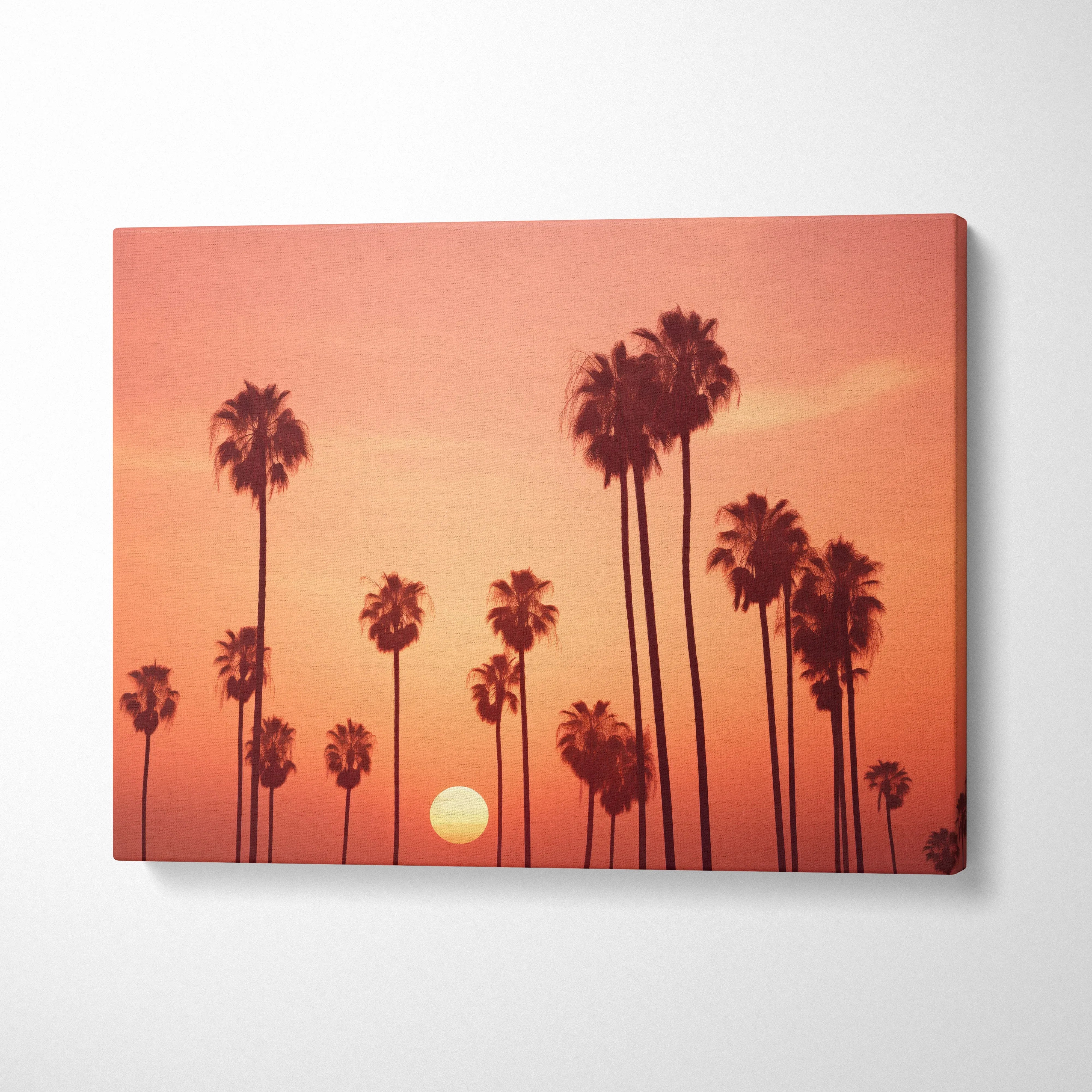 Tropical sunset palm trees silhouette on vibrant orange canvas wall art decor.