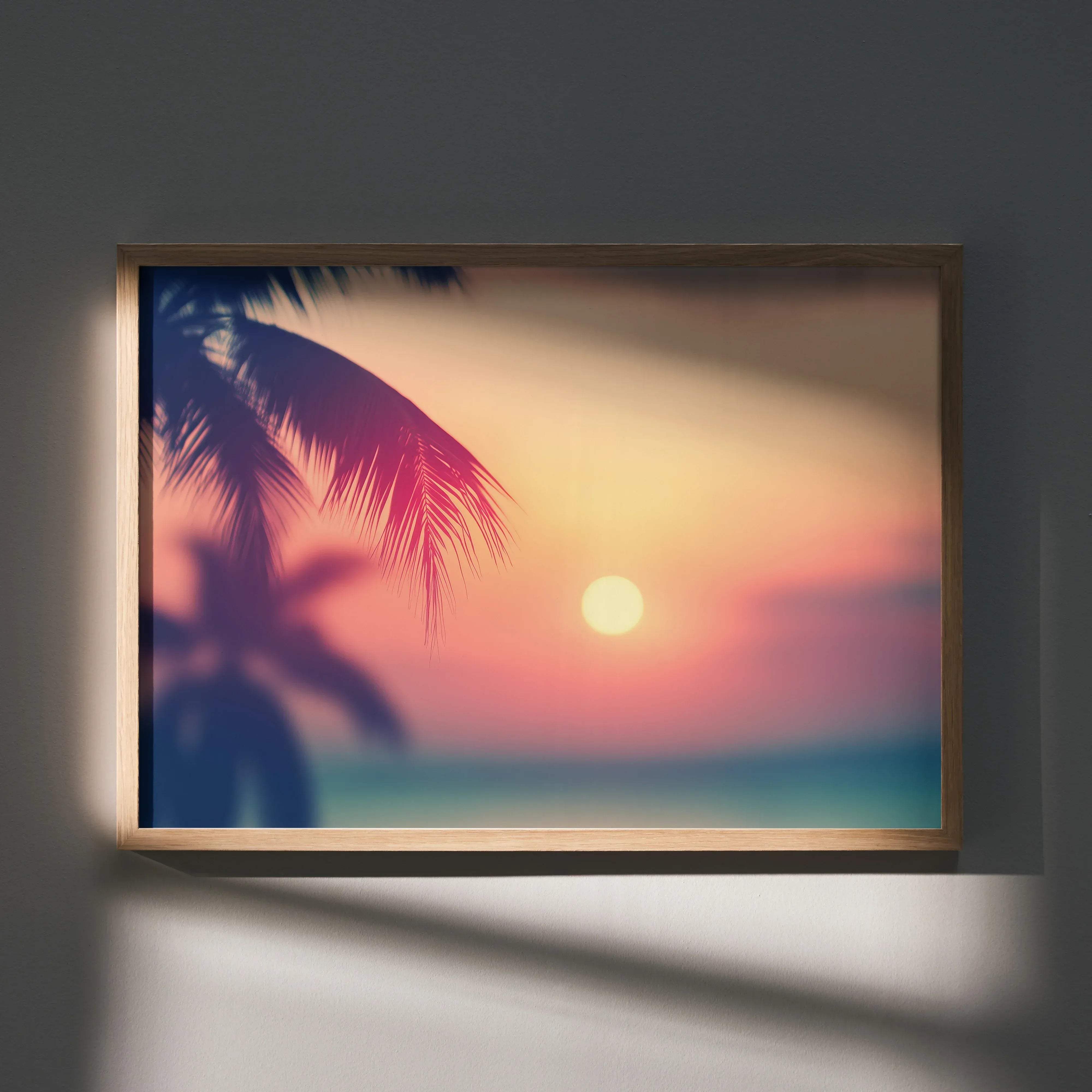 A serene beach digital art wall poster print with palm frond silhouettes at sunset in a light wood frame