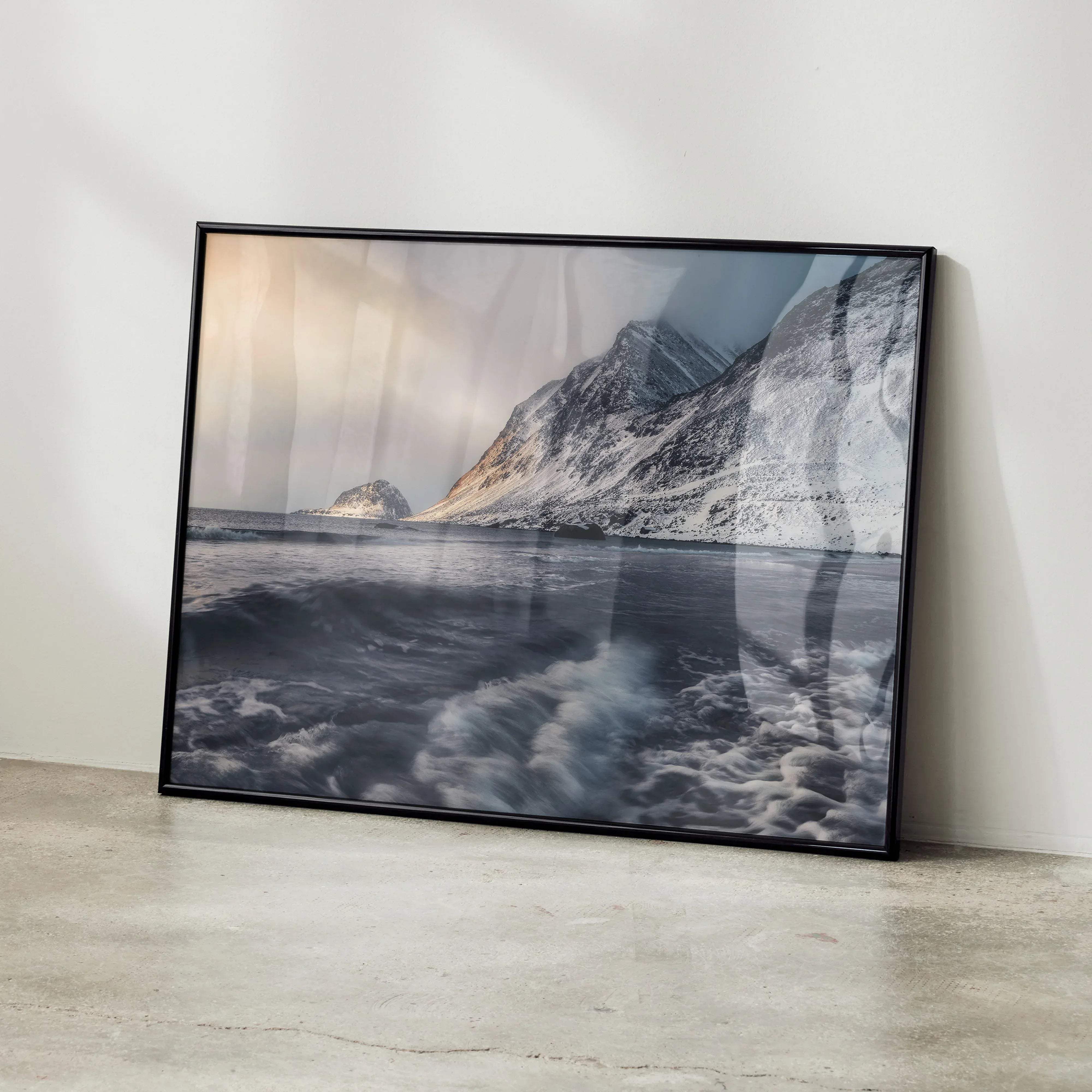 Black-framed photographic art poster featuring a snowy mountain and ocean scene titled majestic mountain sunset snowy peaks