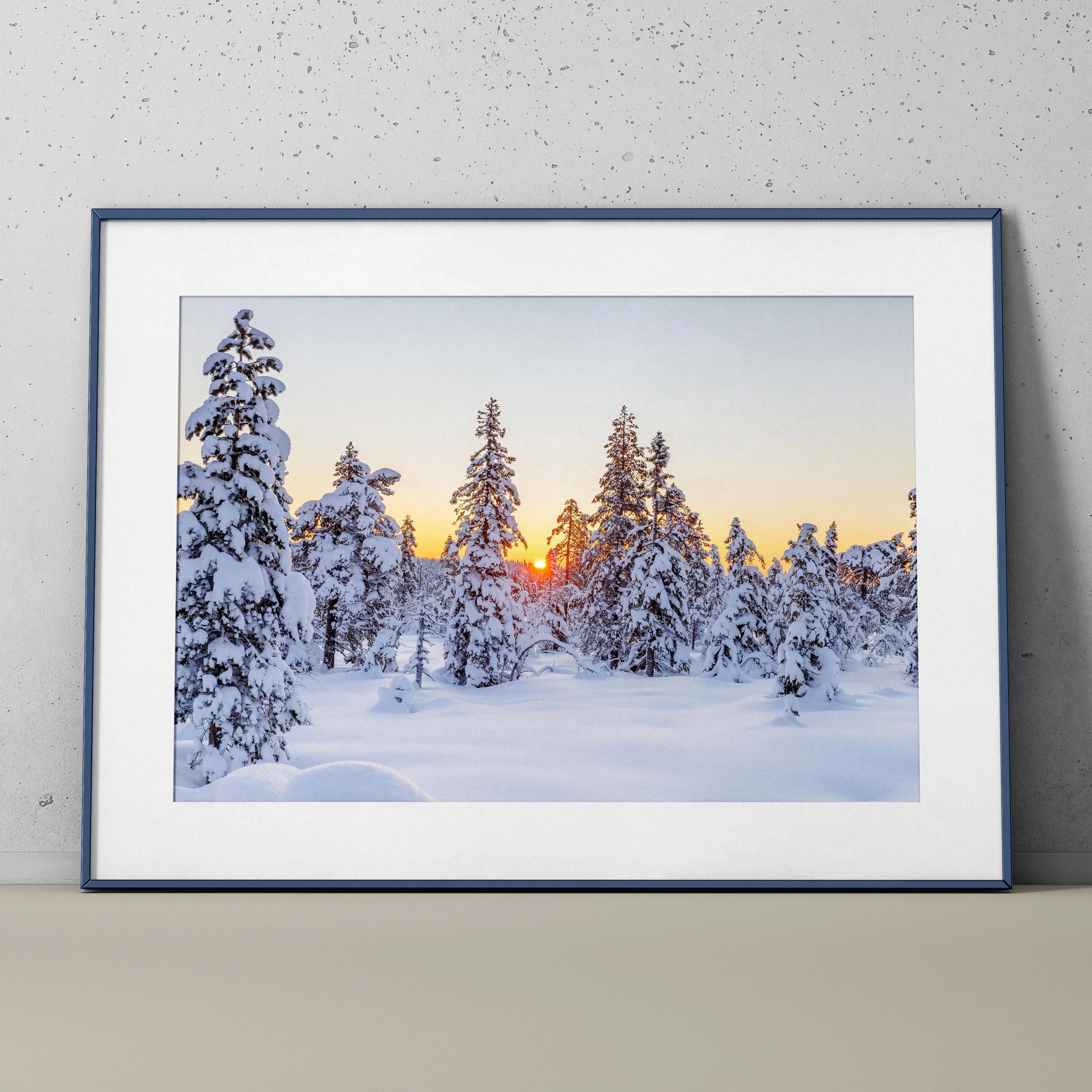 Serene snowy mountain landscape poster with snow-covered pine trees and a sunset sky wall art.