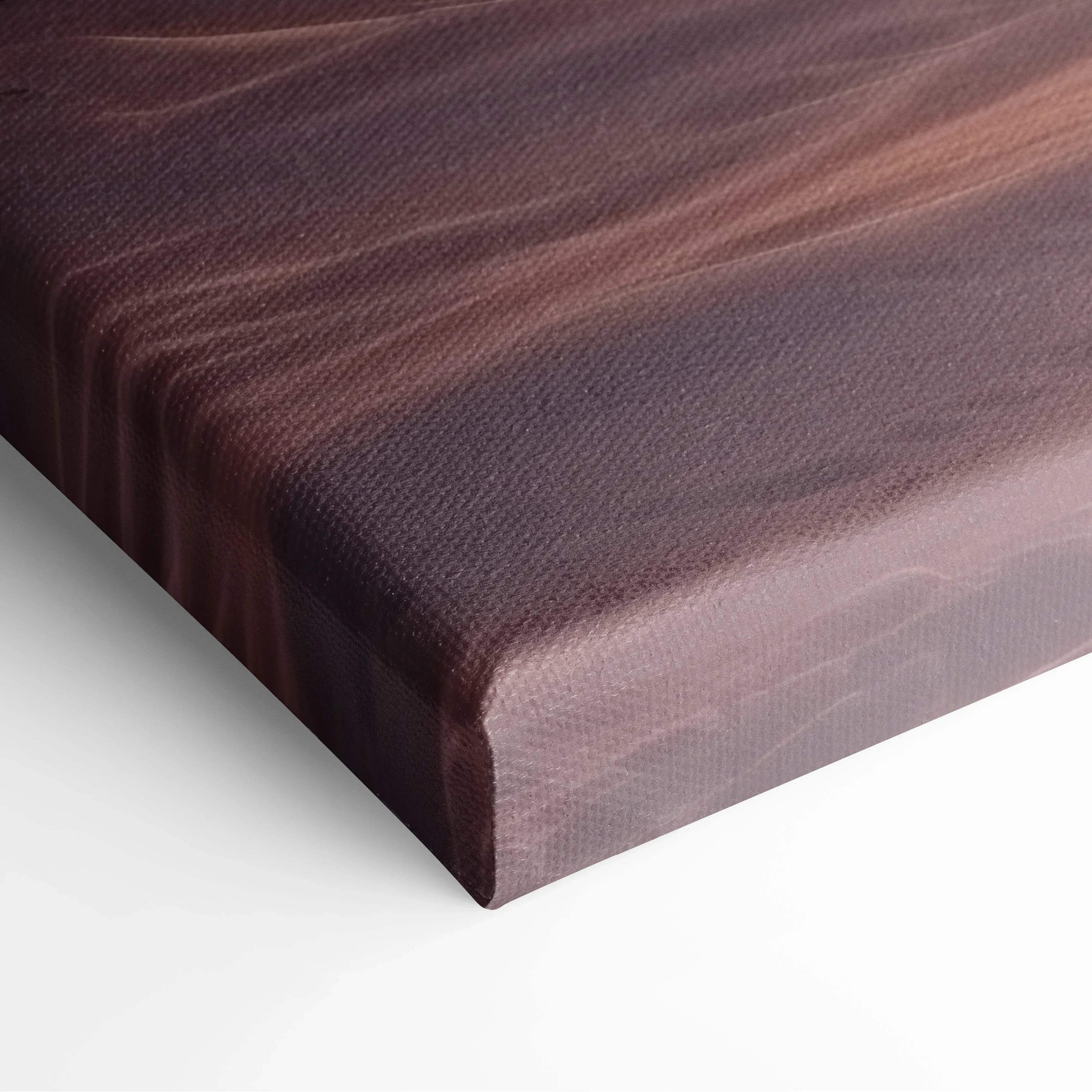 Dark brown wooden cutting board with polished surface and visible grain displayed alongside dreamy winter landscape canvas wall art
