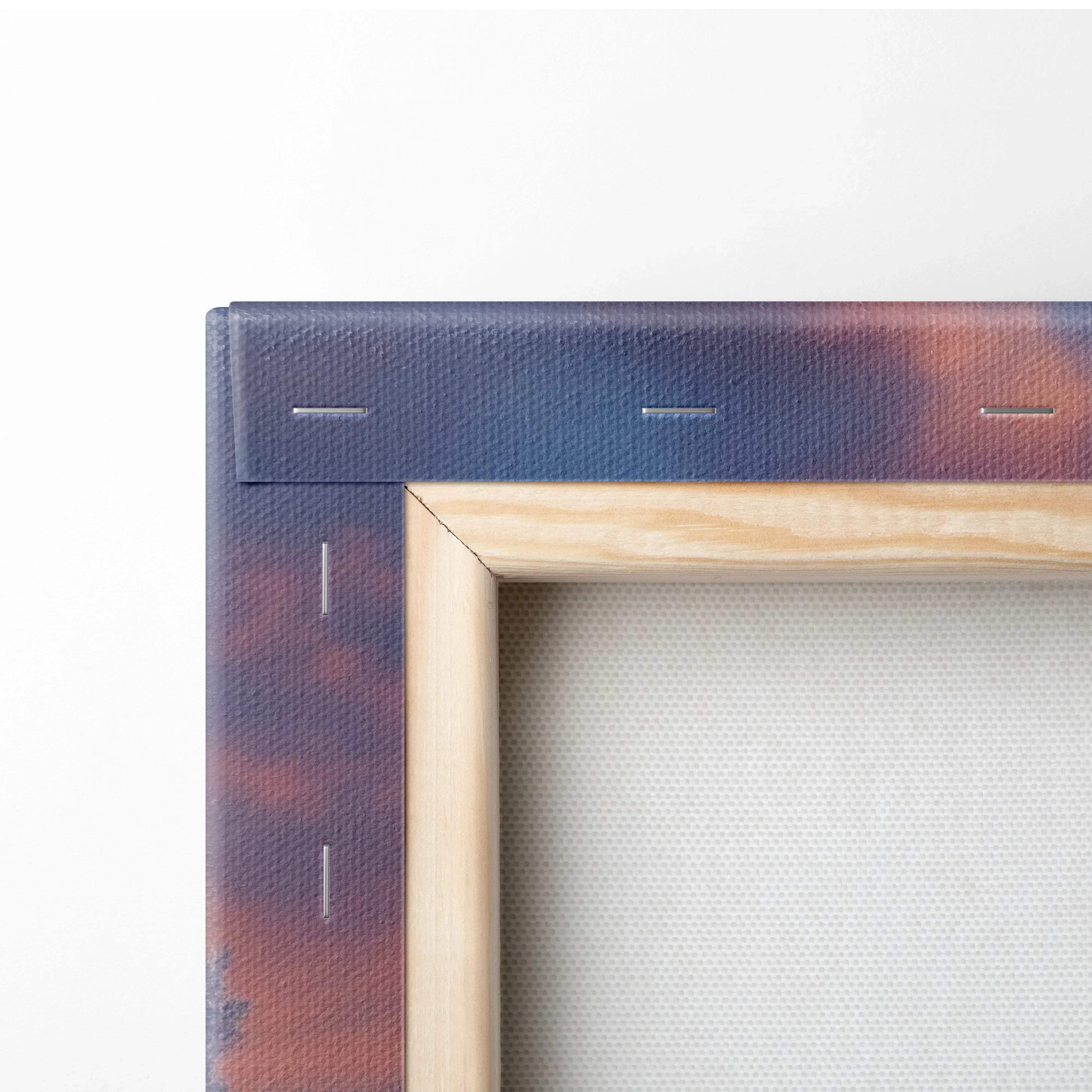A wooden-framed canvas print featuring a stitched gradient sky in deep blues and warm oranges for dreamy winter decor