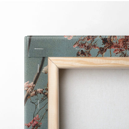 Wooden-framed canvas print of surreal cherry blossoms in dreamy blue tones