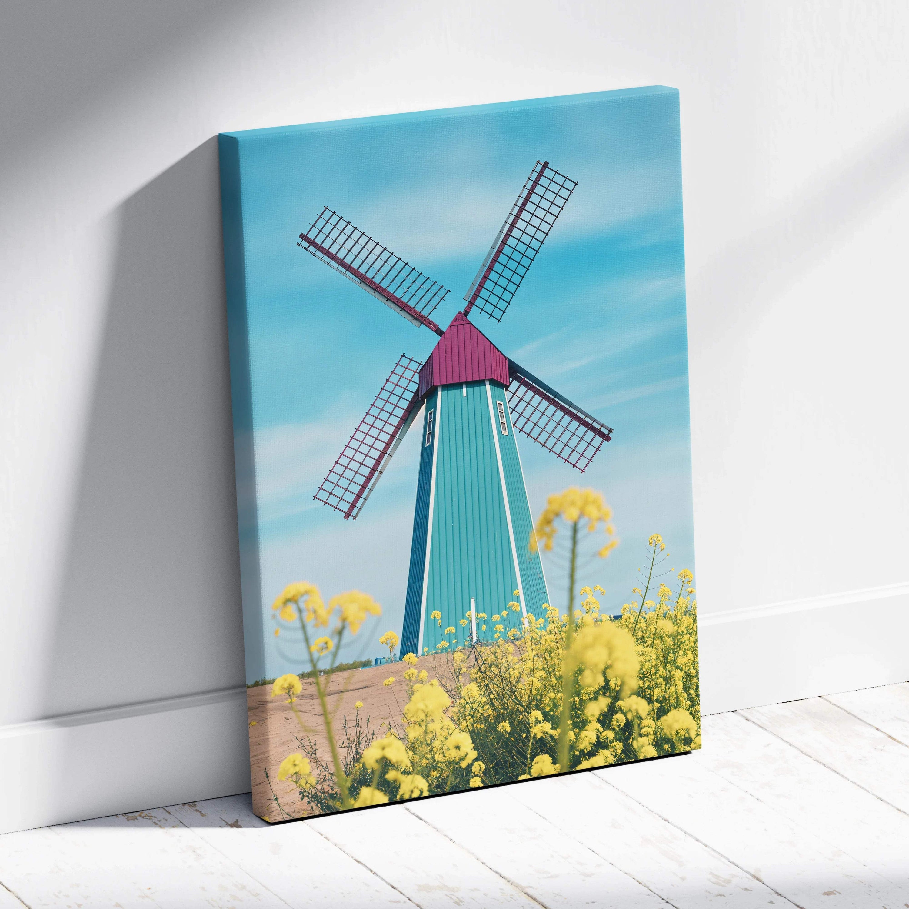 Vibrant teal magenta windmill canvas art over yellow flowers blue sky