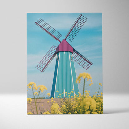 Surreal turquoise magenta windmill with red blades over yellow flowers blue sky canvas art