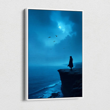Blue-toned canvas wall art of solitary figure on coastal cliff overlooking moody ocean