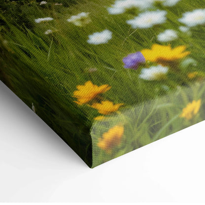 Canvas print of thatched stone cottage in wildflower meadow