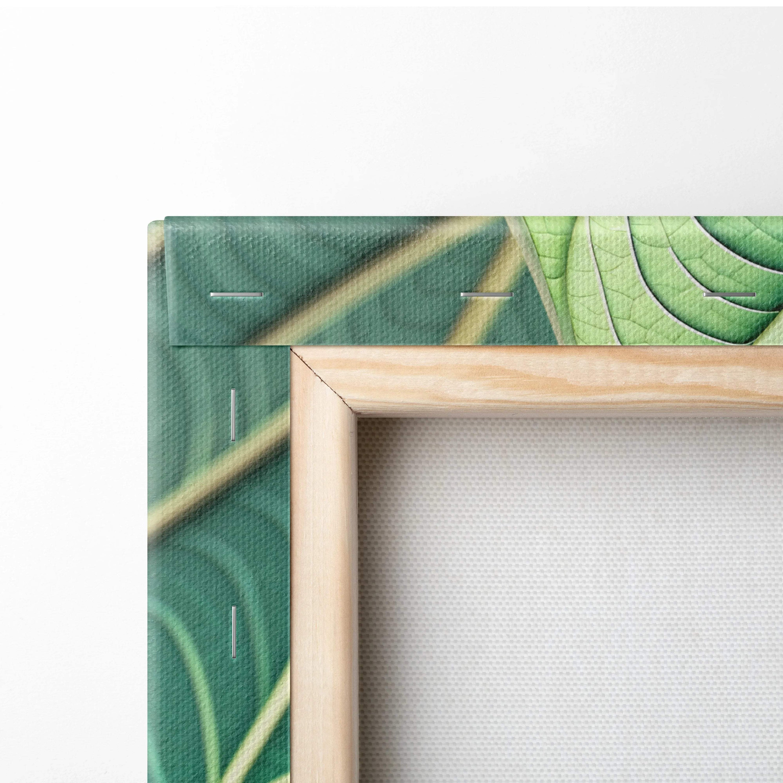 Framed canvas wall art with emerald leaf veins in green and gold pattern