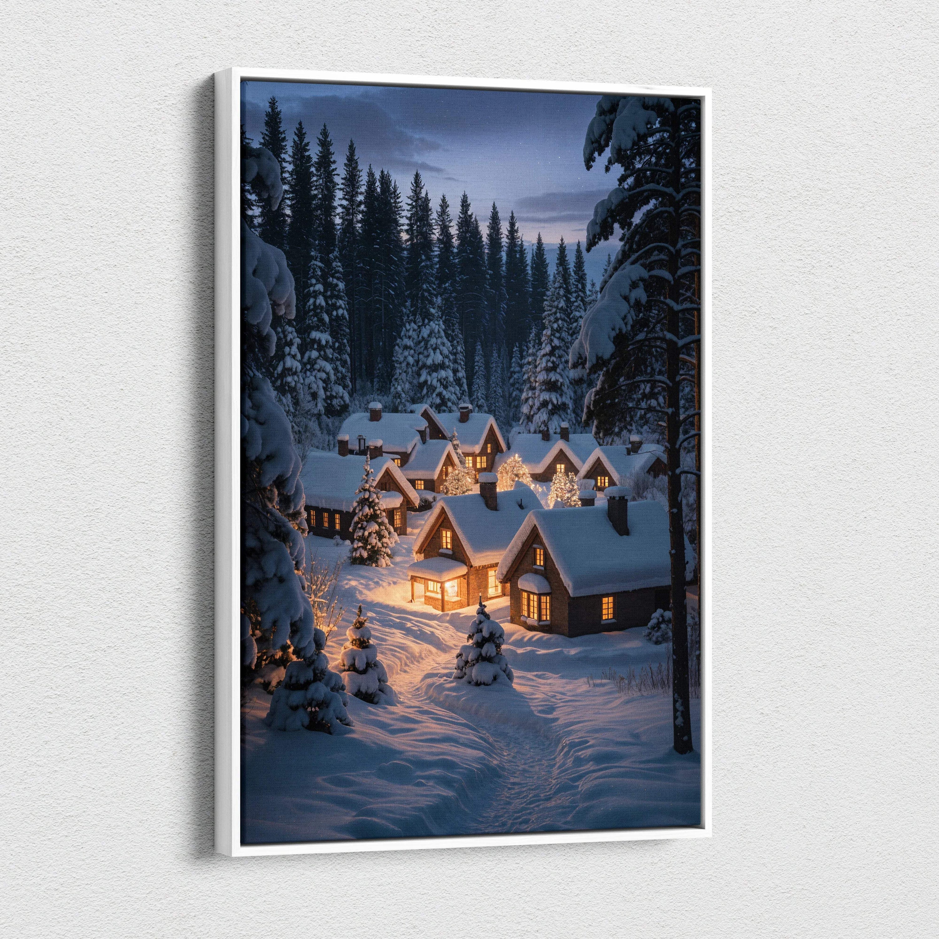 White-framed canvas print of dreamlike winter village at dusk with snowy cabins and pines
