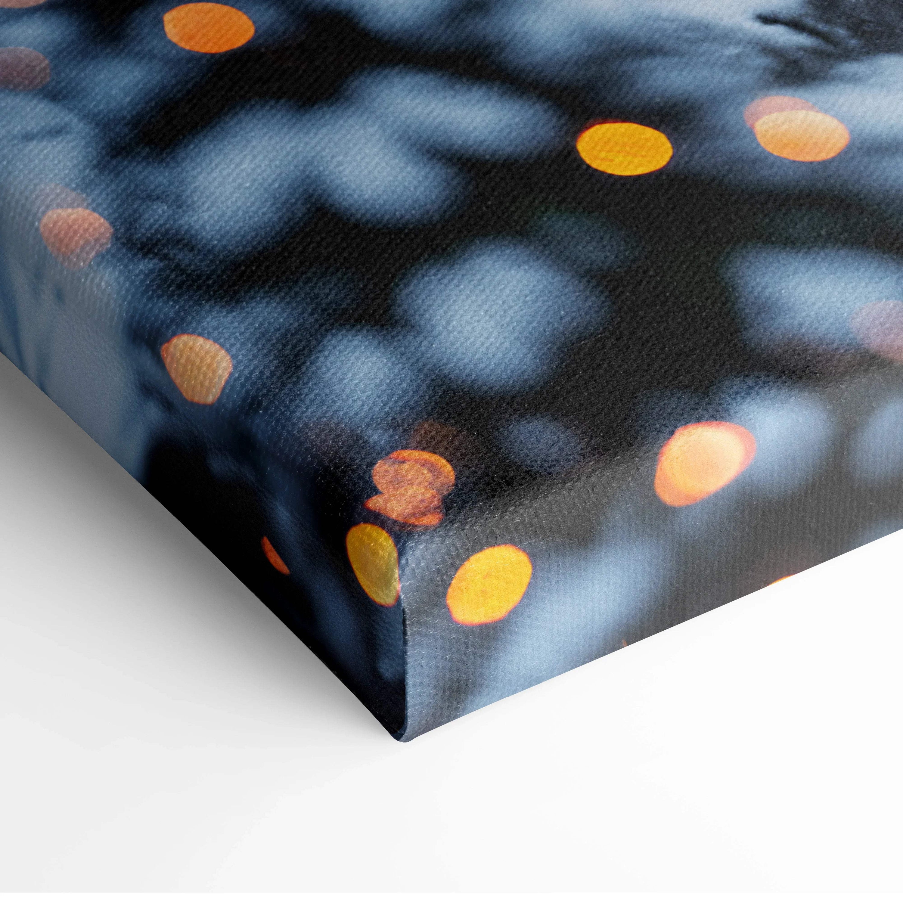 Canvas print of cozy snowy village with warm bokeh lights on dark blue