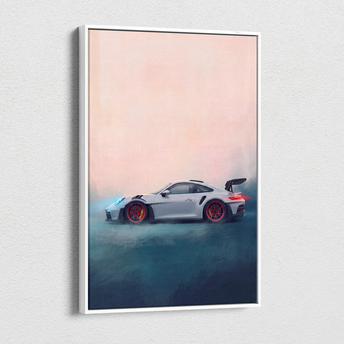 White-framed canvas print of silver porsche 911 gt3 rs with red wheels and glowing taillights against gradient sky